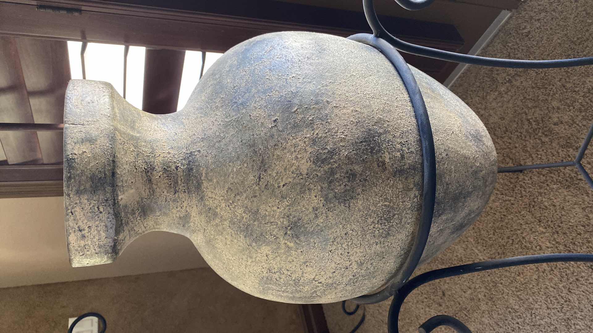 Photo 1 of LARGE POTTERY VASE IN WROUGHT IRON STAND 24“ x 42“