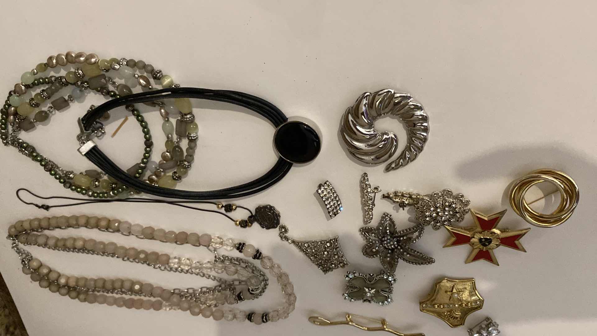 Photo 1 of ASSORTED COSTUME JEWELRY PINS AND NECKLACES