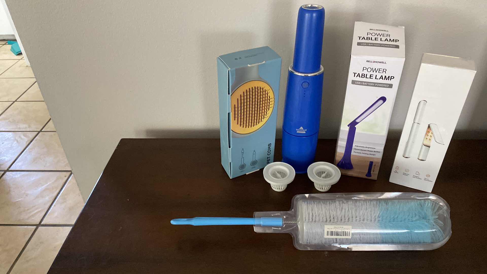 Photo 1 of HOUSEHOLD ITEMS BISSELL VACUUM PET COMB TABLE LAMP AND MORE