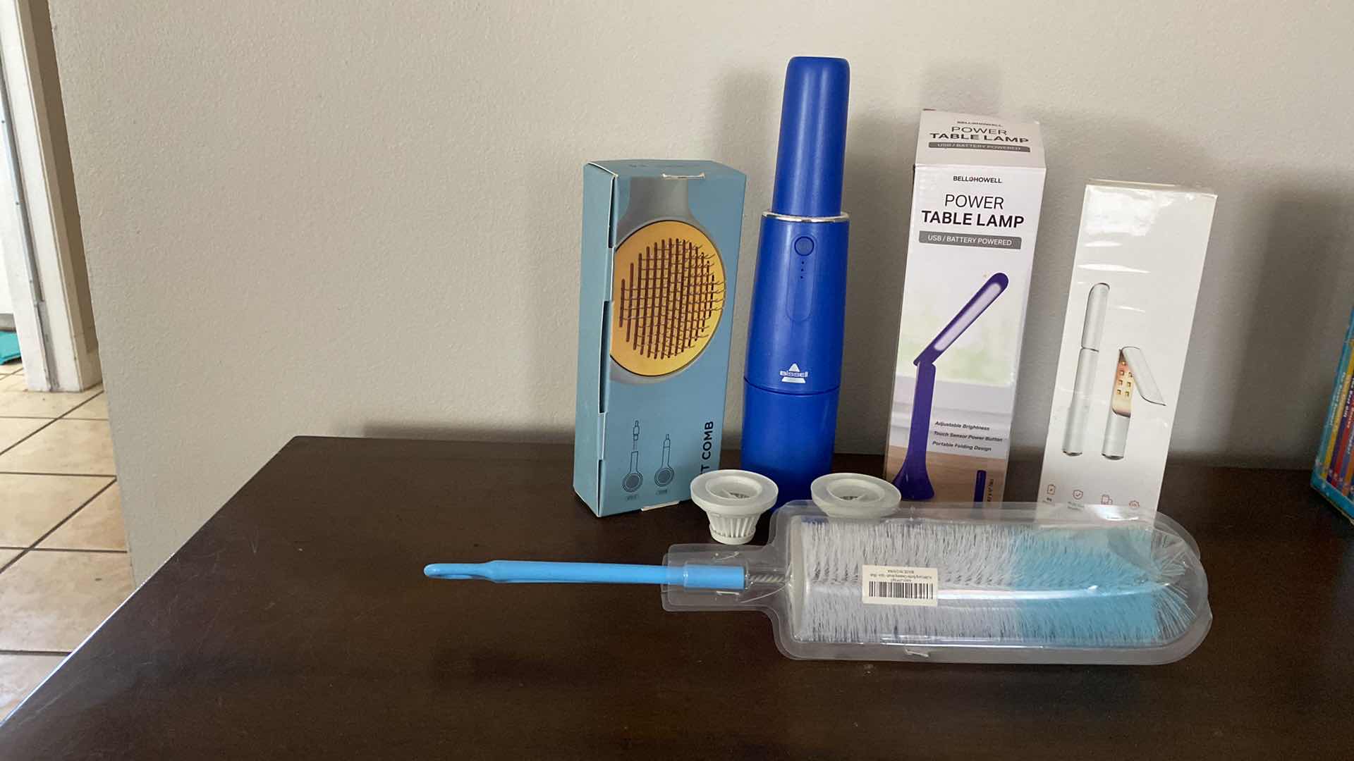 Photo 1 of HOUSEHOLD ITEMS BISSELL VACUUM PET COMB TABLE LAMP AND MORE
