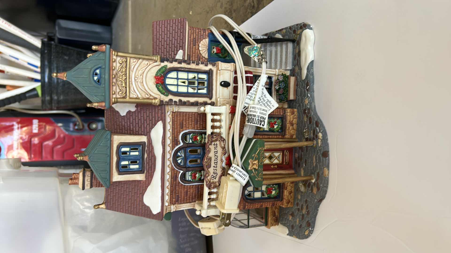 Photo 1 of LARGE TOTE WITH CHRISTMAS VILLAGE LIGHT UP HOUSES TALLEST 14”