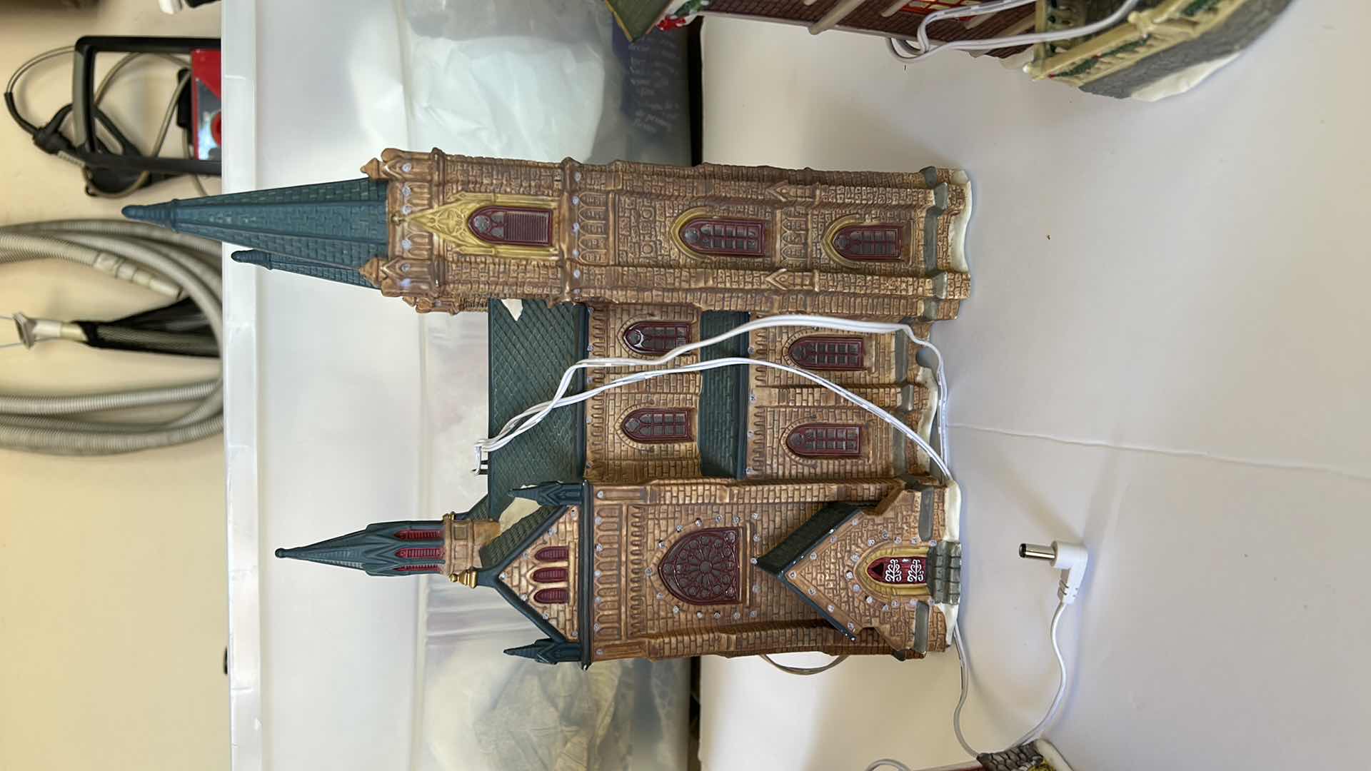 Photo 1 of LARGE TOTE WITH CHRISTMAS VILLAGE LIGHT UP HOUSES TALLEST 14”