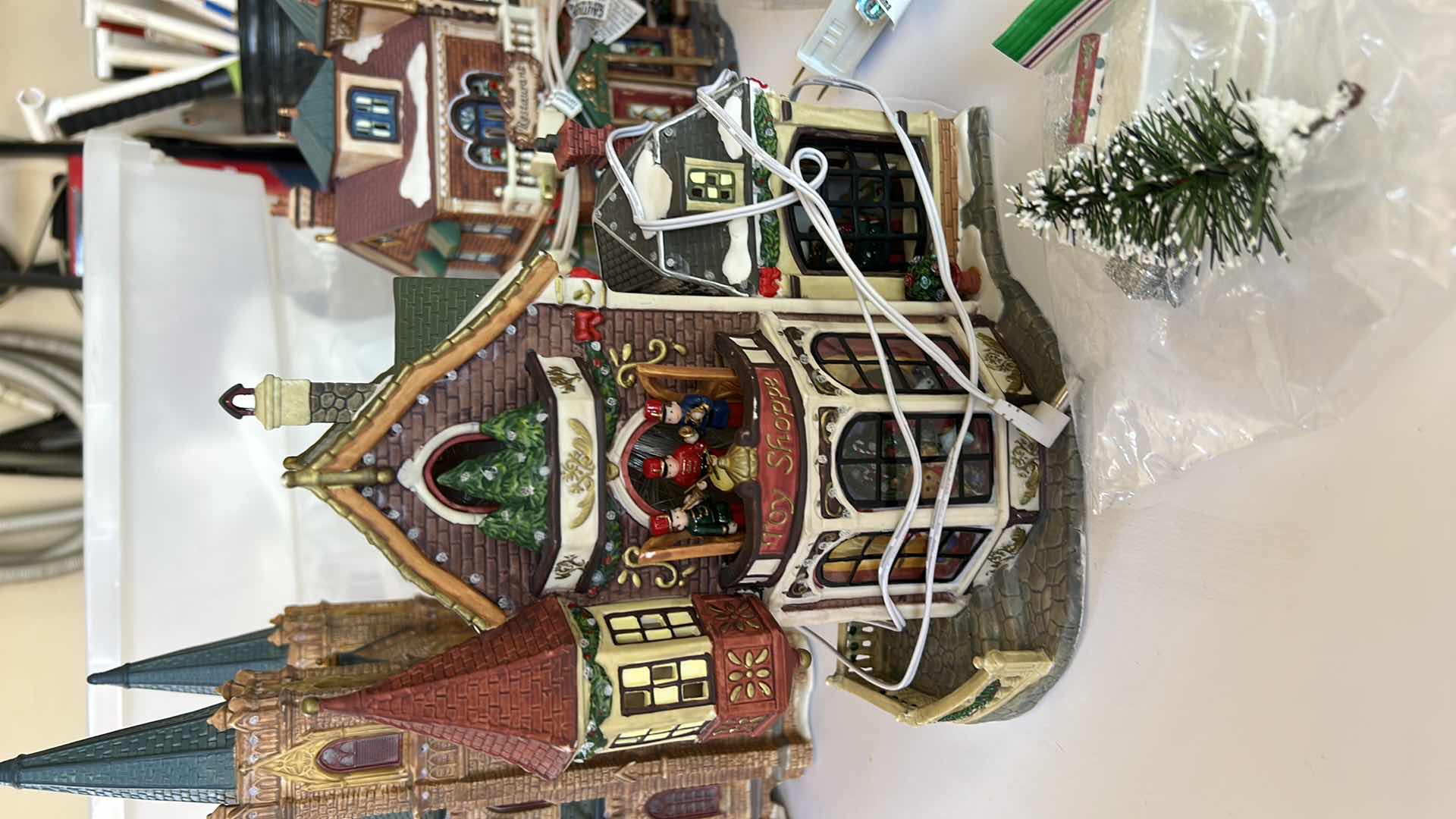 Photo 1 of LARGE TOTE WITH CHRISTMAS VILLAGE LIGHT UP HOUSES TALLEST 14”