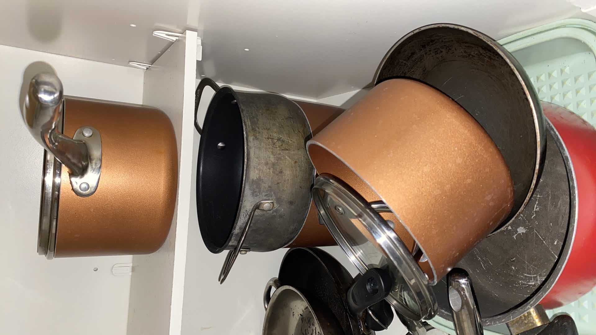 Photo 1 of CONTENTS OF KITCHEN CABINET POTS AND PANS