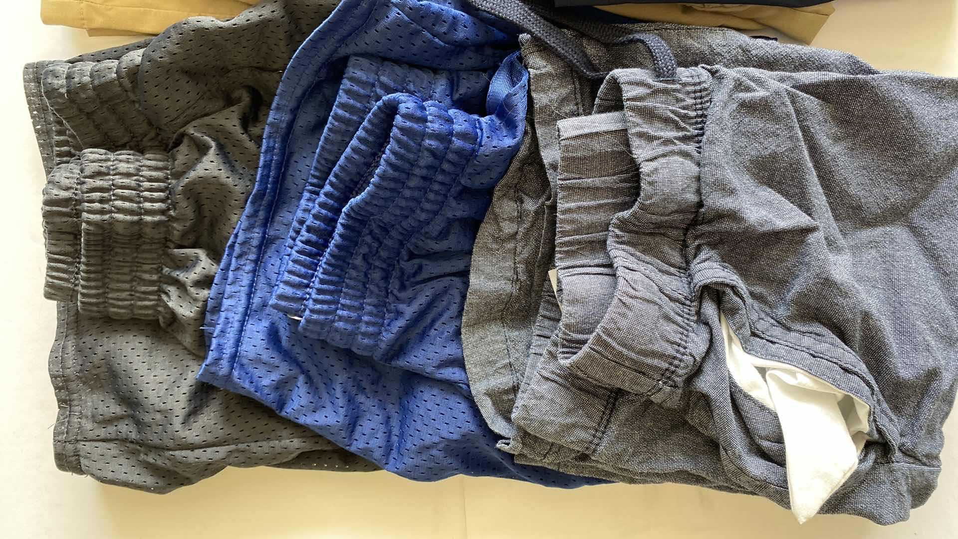 Photo 1 of CHILDRENS SIZE LARGE SHIRTS AND SHORTS, 1 PAIR JEANS