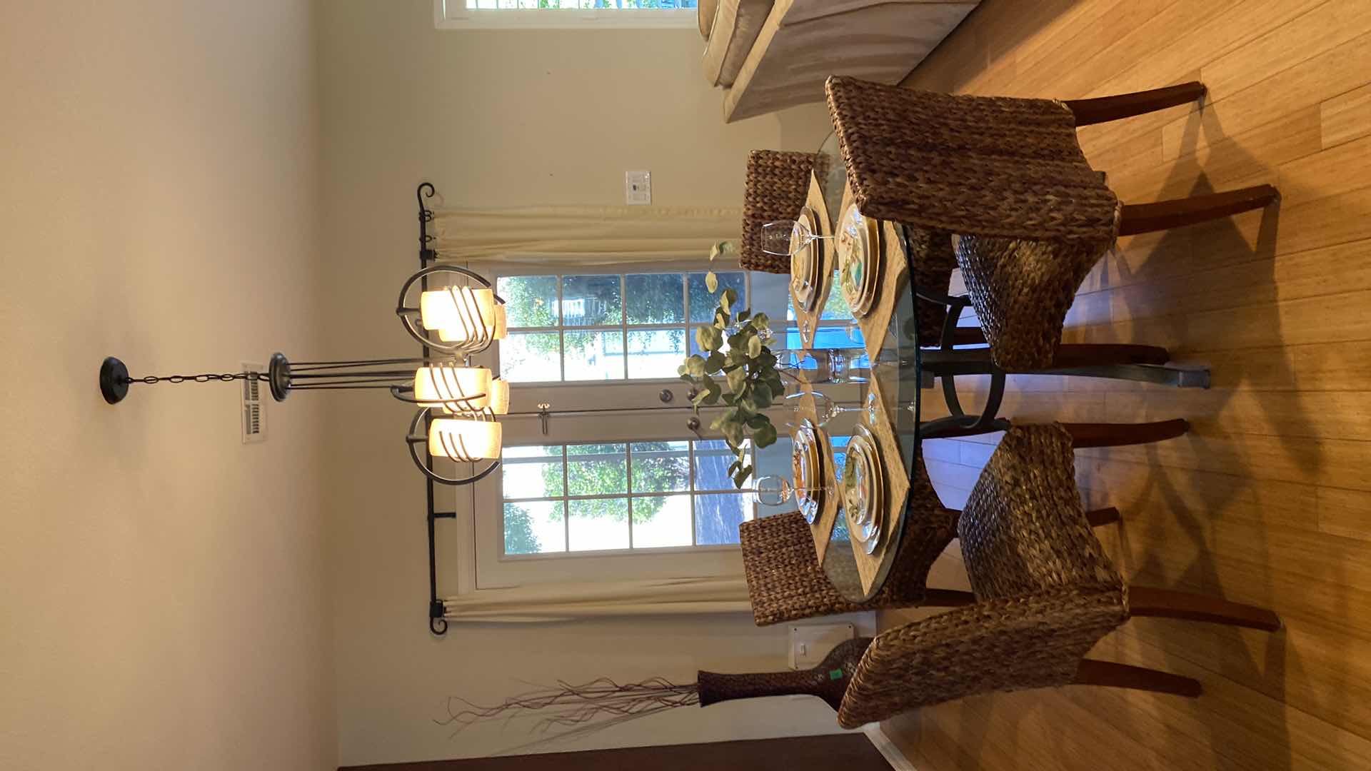 Photo 1 of GLASS TOP METAL DINING TABLE WITH 4 WEAVED CHAIRS 51” X H 30”