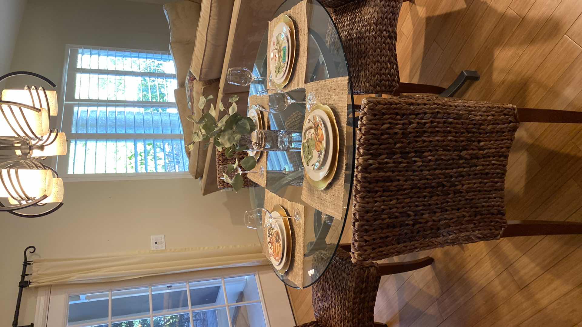 Photo 1 of GLASS TOP METAL DINING TABLE WITH 4 WEAVED CHAIRS 51” X H 30”