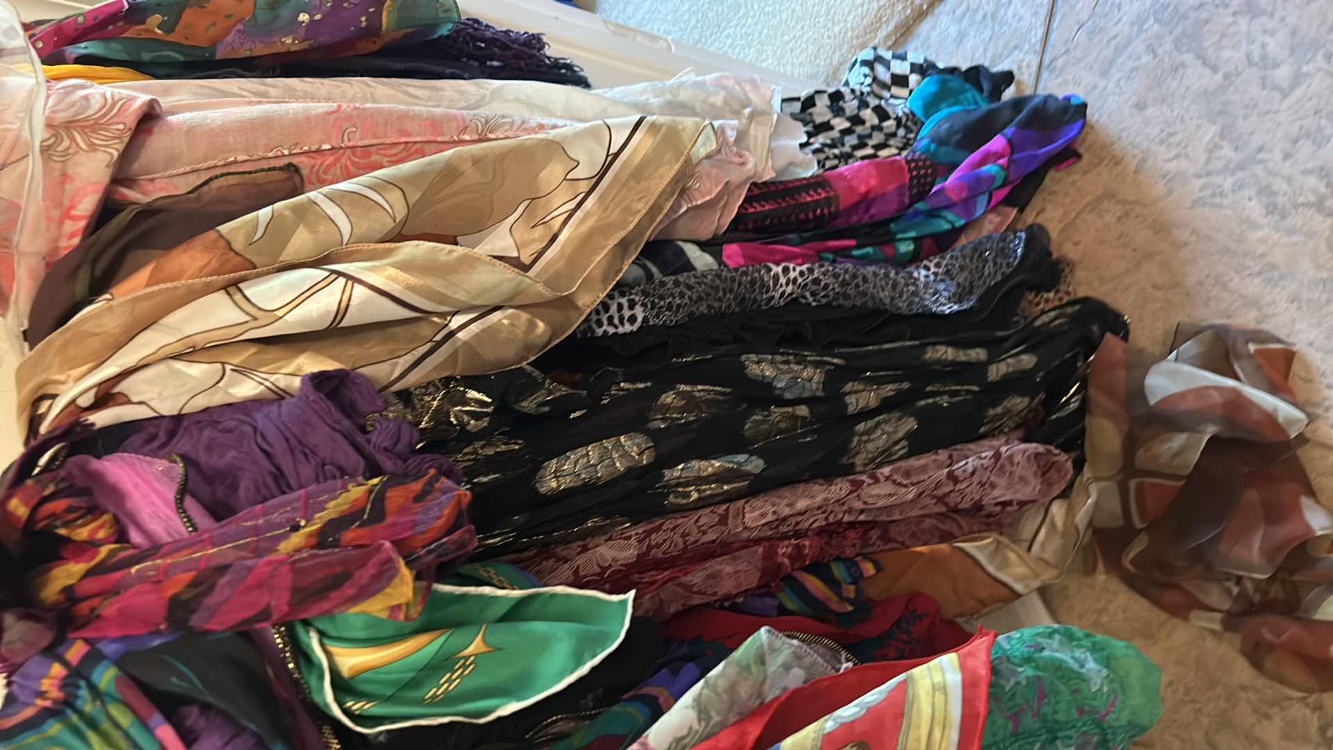 Photo 1 of BOTTOM RACK OF SCARVES