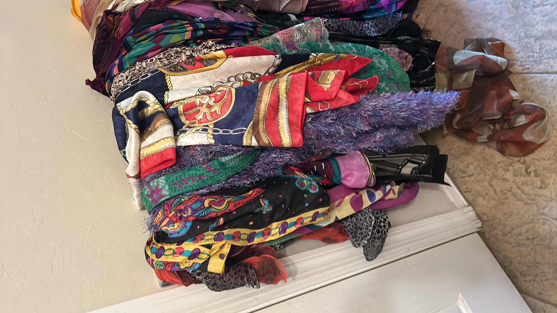 Photo 1 of BOTTOM RACK OF SCARVES