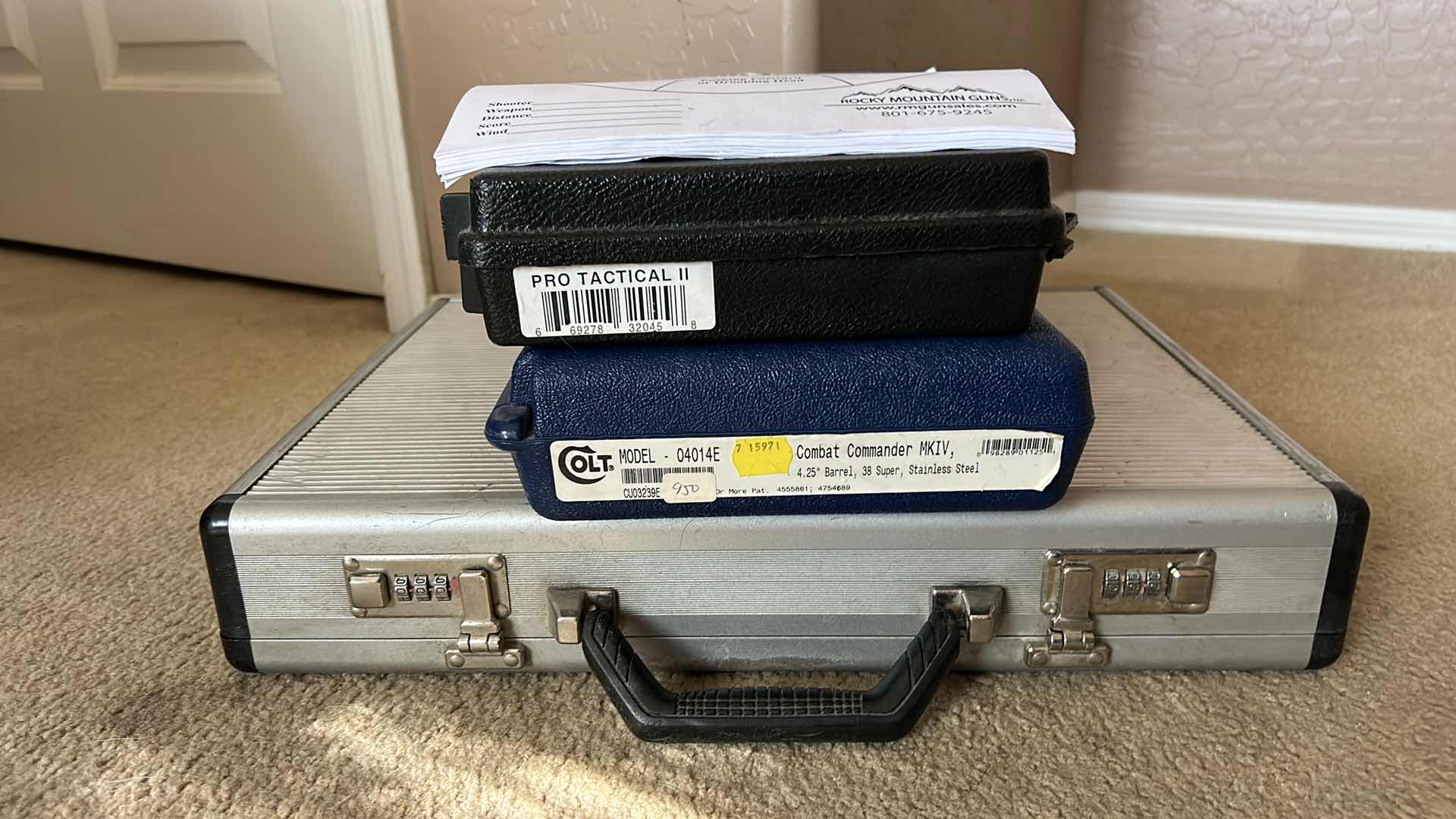 Photo 1 of 2 GUN CASES, BRIEF CASE AND SHOOTING TARGET SHEETS