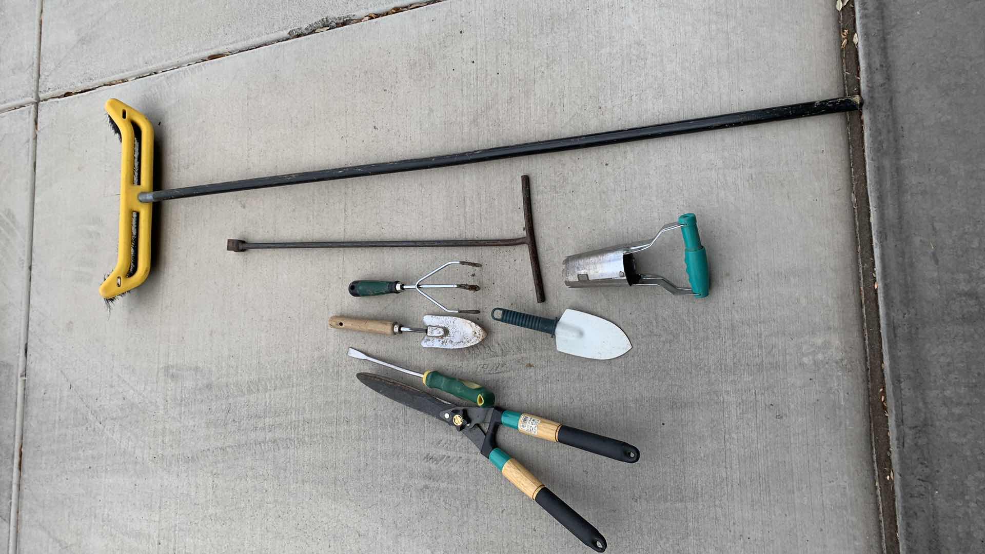 Photo 1 of GARDEN TOOLS AND A BROOM
