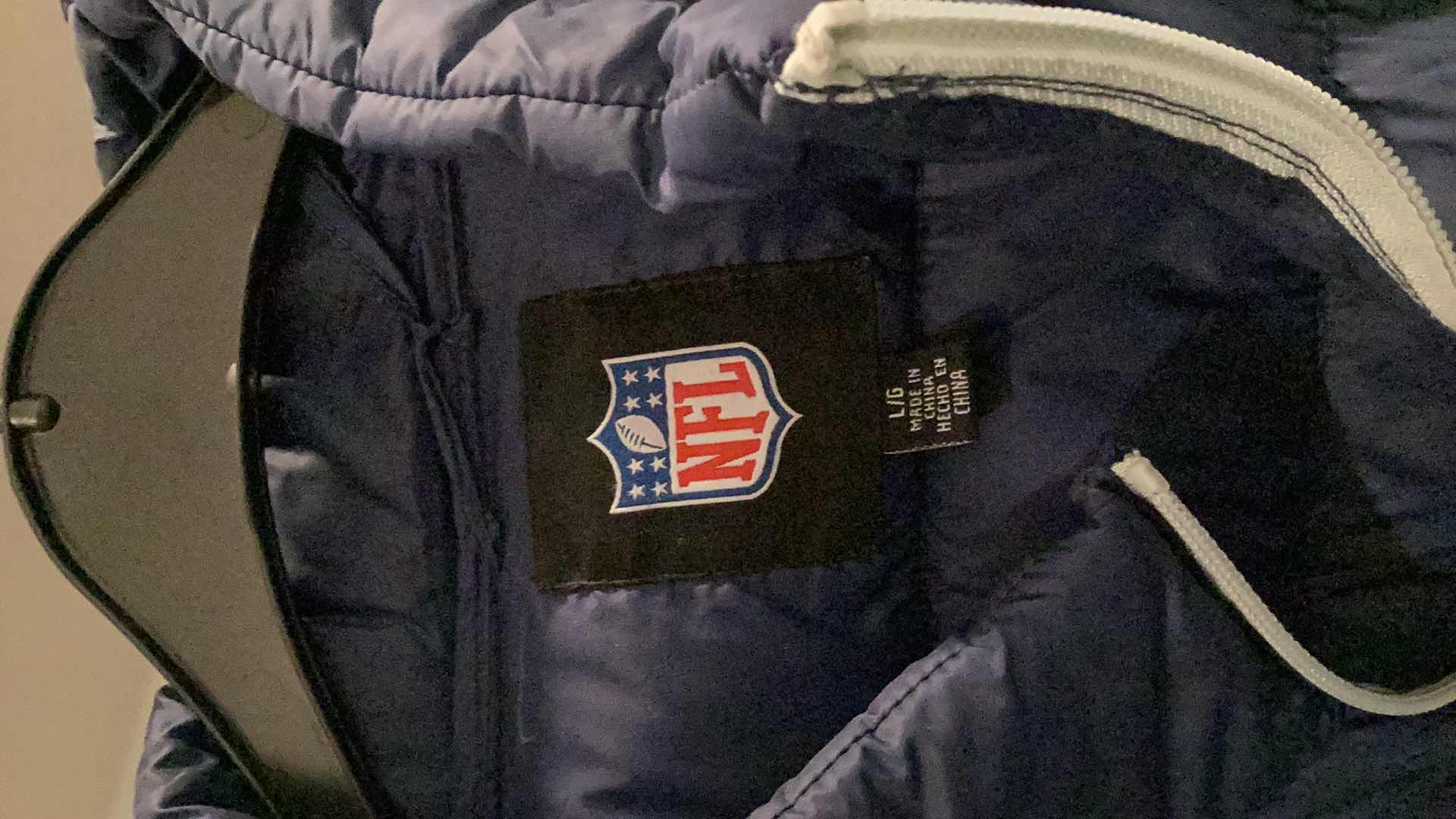 Photo 1 of DALLAS COWBOYS JACKET AND OTHER MERCHANDISE 3 PAIR SIZES VARY FROM L TO XL.