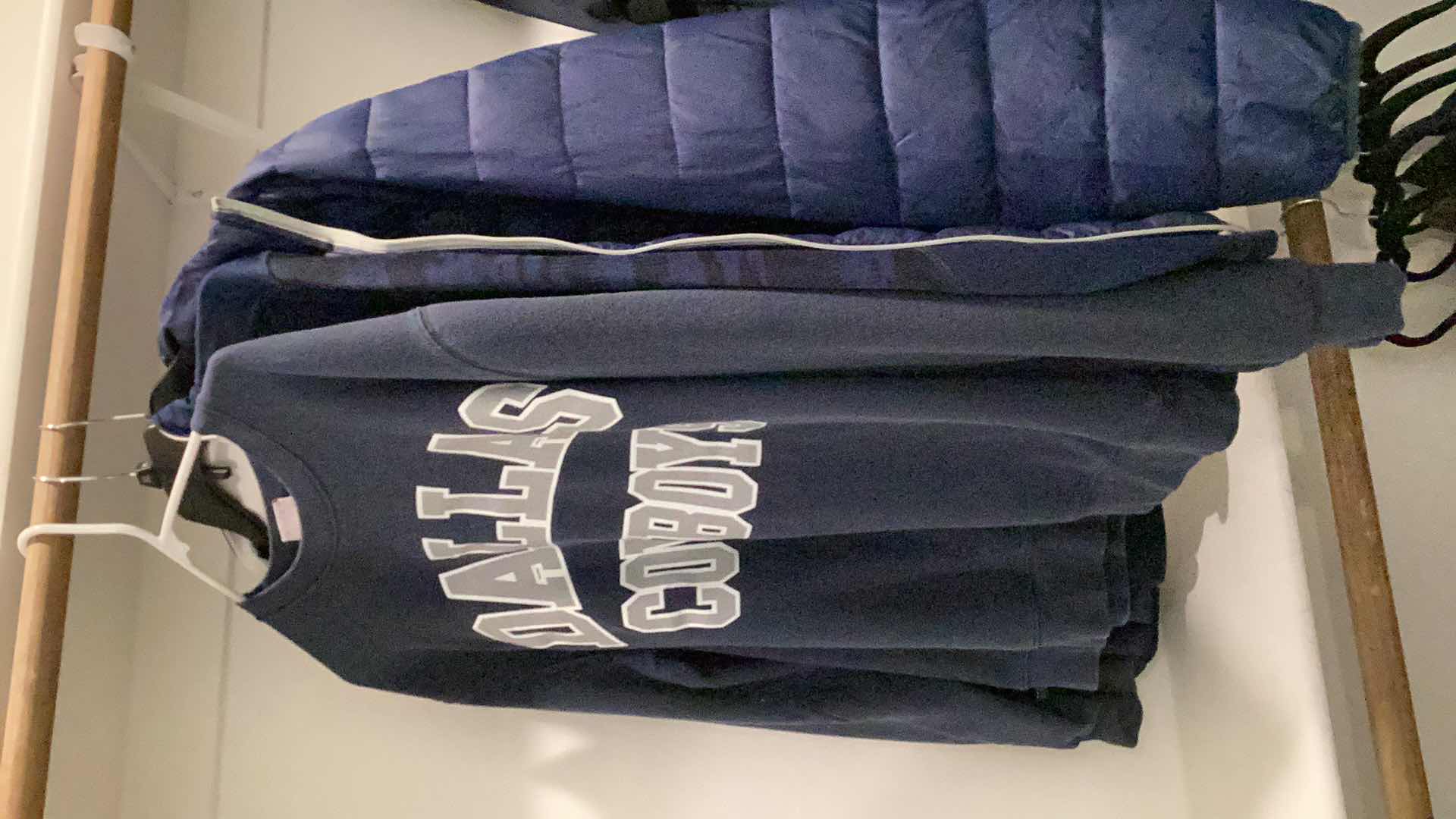 Photo 1 of DALLAS COWBOYS JACKET AND OTHER MERCHANDISE 3 PAIR SIZES VARY FROM L TO XL.