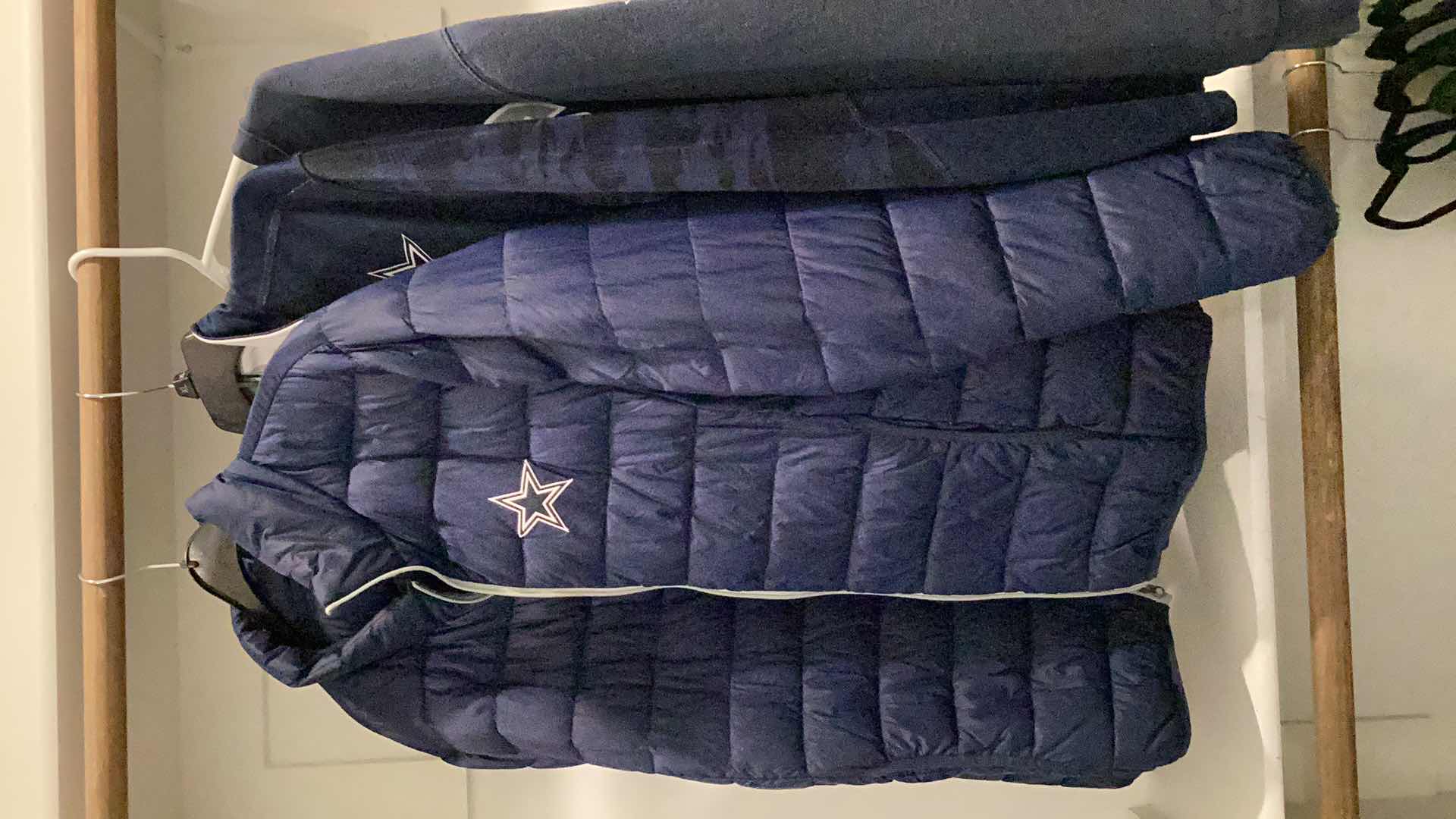 Photo 1 of DALLAS COWBOYS JACKET AND OTHER MERCHANDISE 3 PAIR SIZES VARY FROM L TO XL.