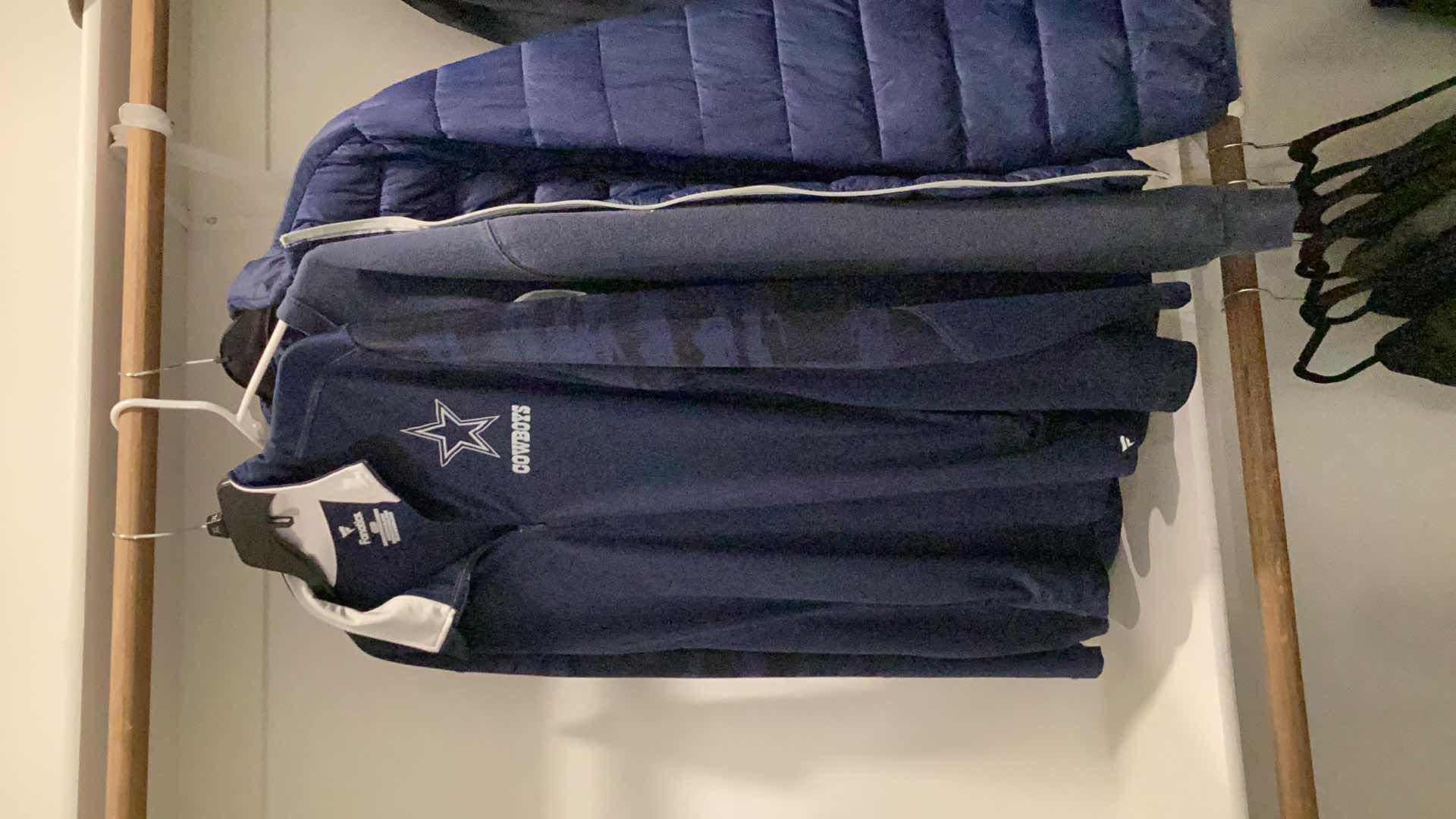 Photo 1 of DALLAS COWBOYS JACKET AND OTHER MERCHANDISE 3 PAIR SIZES VARY FROM L TO XL.