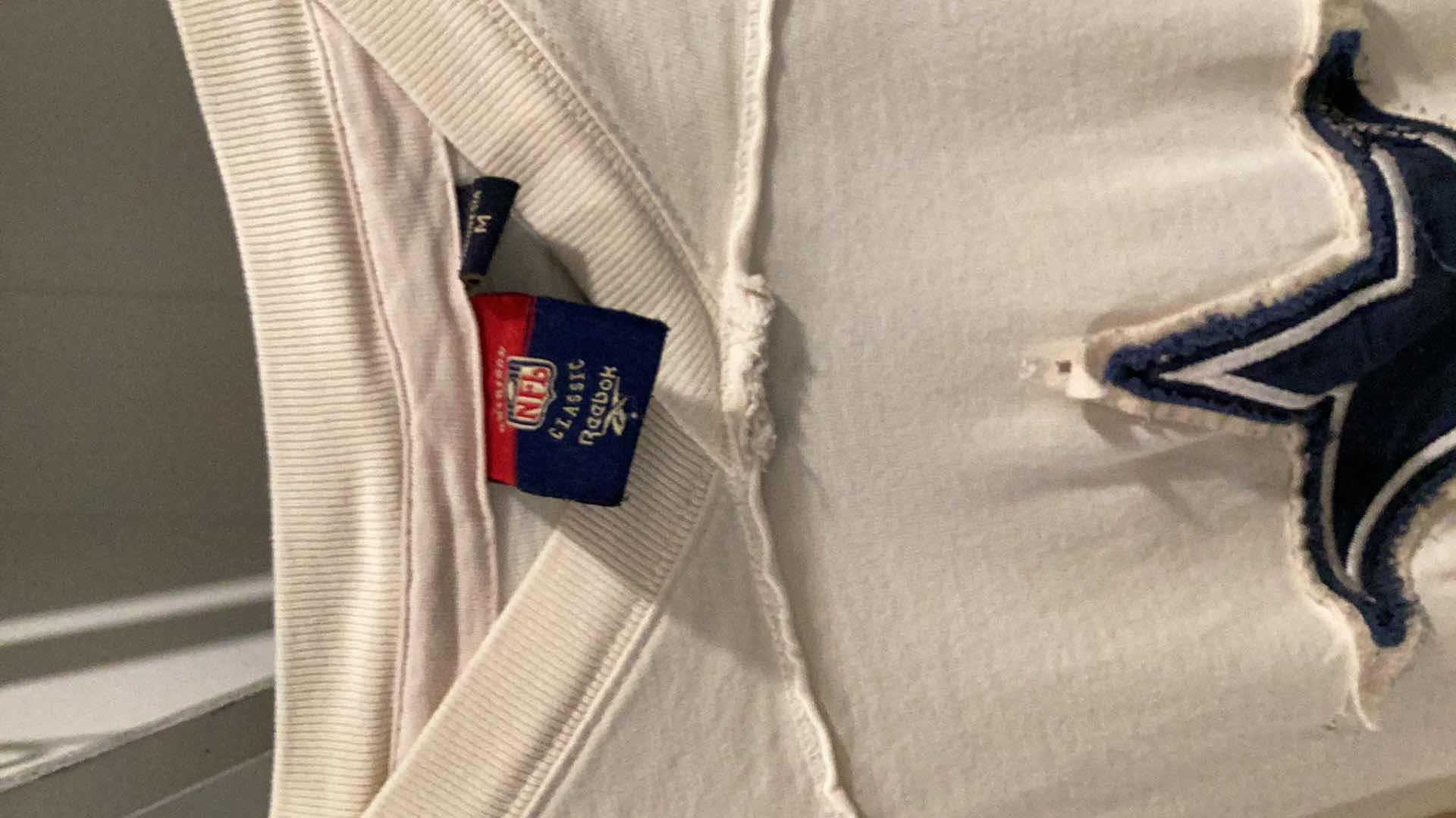 Photo 1 of DALLAS COWBOYS JERSEY WITH COOPER 19 AND A DALLAS COWBOYS TEE SHIRT. SIZES ARE M AND LARGE.