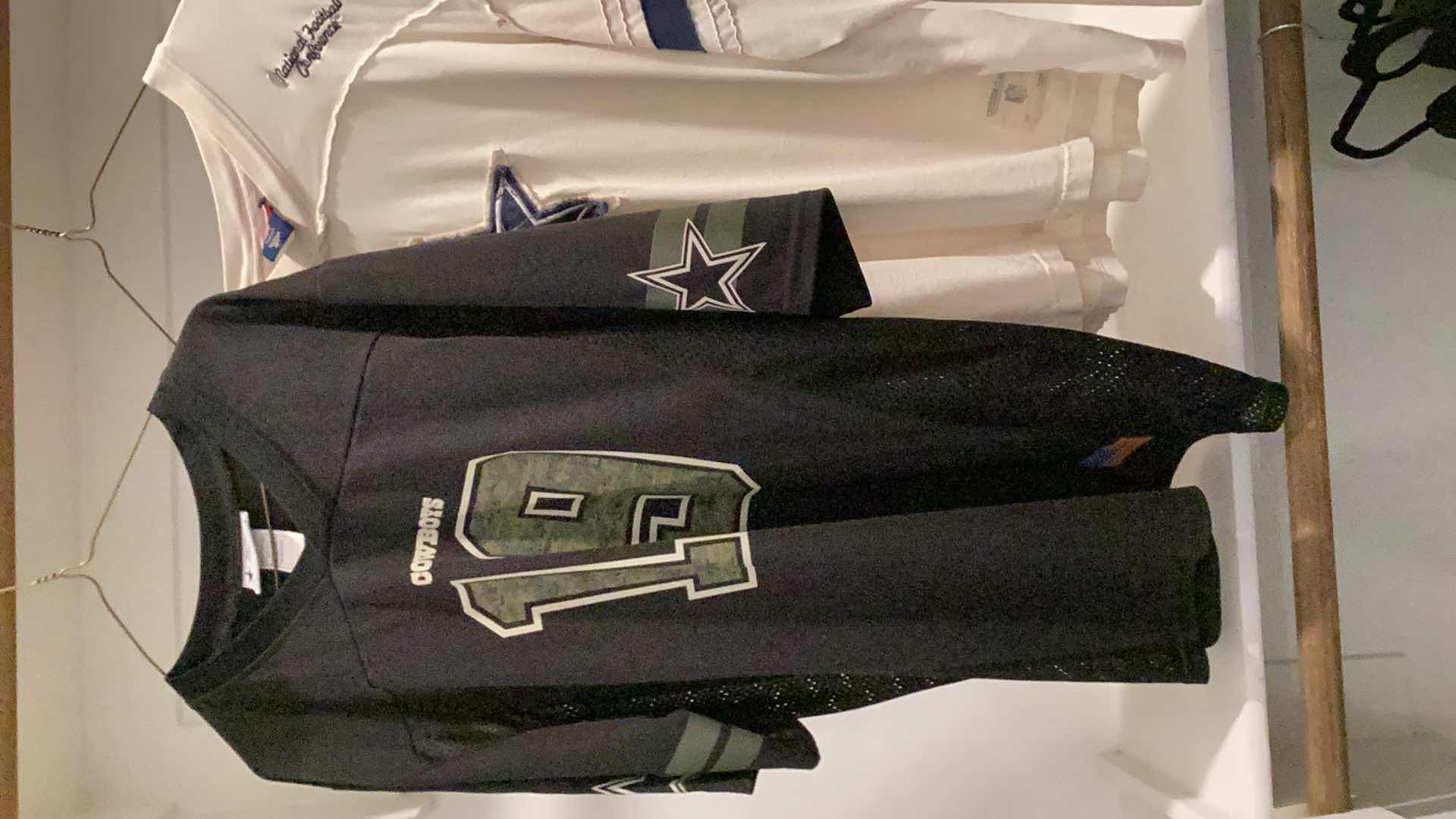 Photo 1 of DALLAS COWBOYS JERSEY WITH COOPER 19 AND A DALLAS COWBOYS TEE SHIRT. SIZES ARE M AND LARGE.