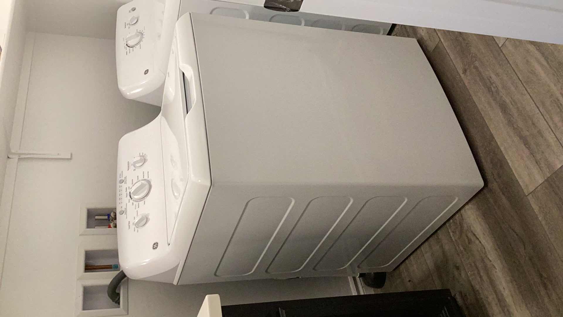 Photo 1 of GE 3.8 CU. FT. CAPACITY STAINLESS STEEL BASKET WASHING MACHINE.
