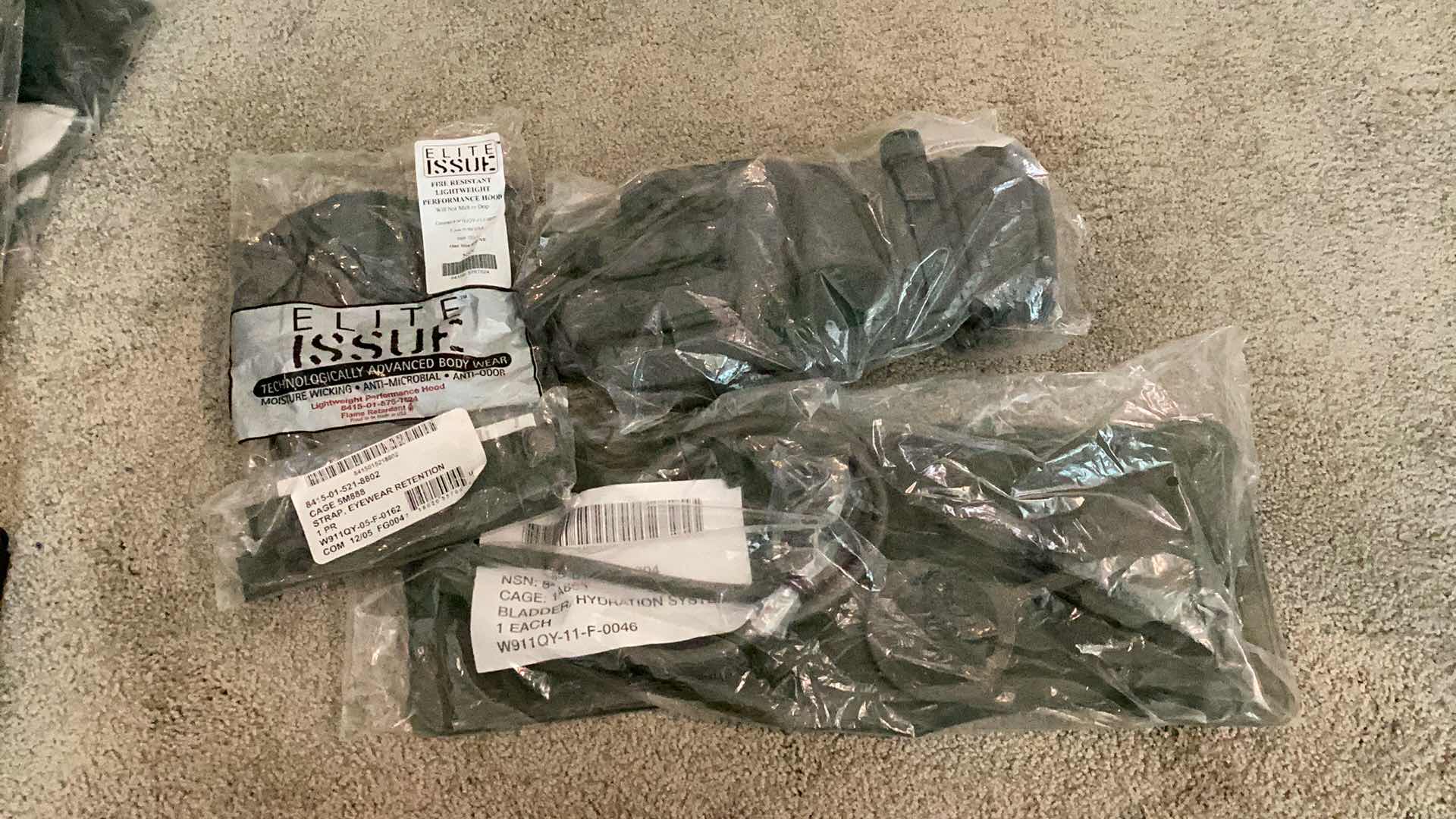 Photo 1 of MILITARY AUTHENTIC GRADE GLOVES, BLADDER HYDRATION PACK, STRAP EYEWEAR RETENTION, FIRE RESISTANT LIGHTWEIGHT HOOD.