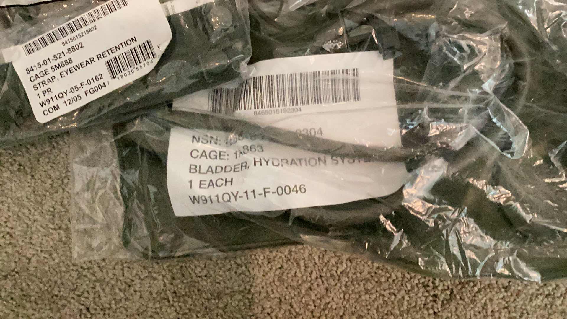 Photo 1 of MILITARY AUTHENTIC GRADE GLOVES, BLADDER HYDRATION PACK, STRAP EYEWEAR RETENTION, FIRE RESISTANT LIGHTWEIGHT HOOD.