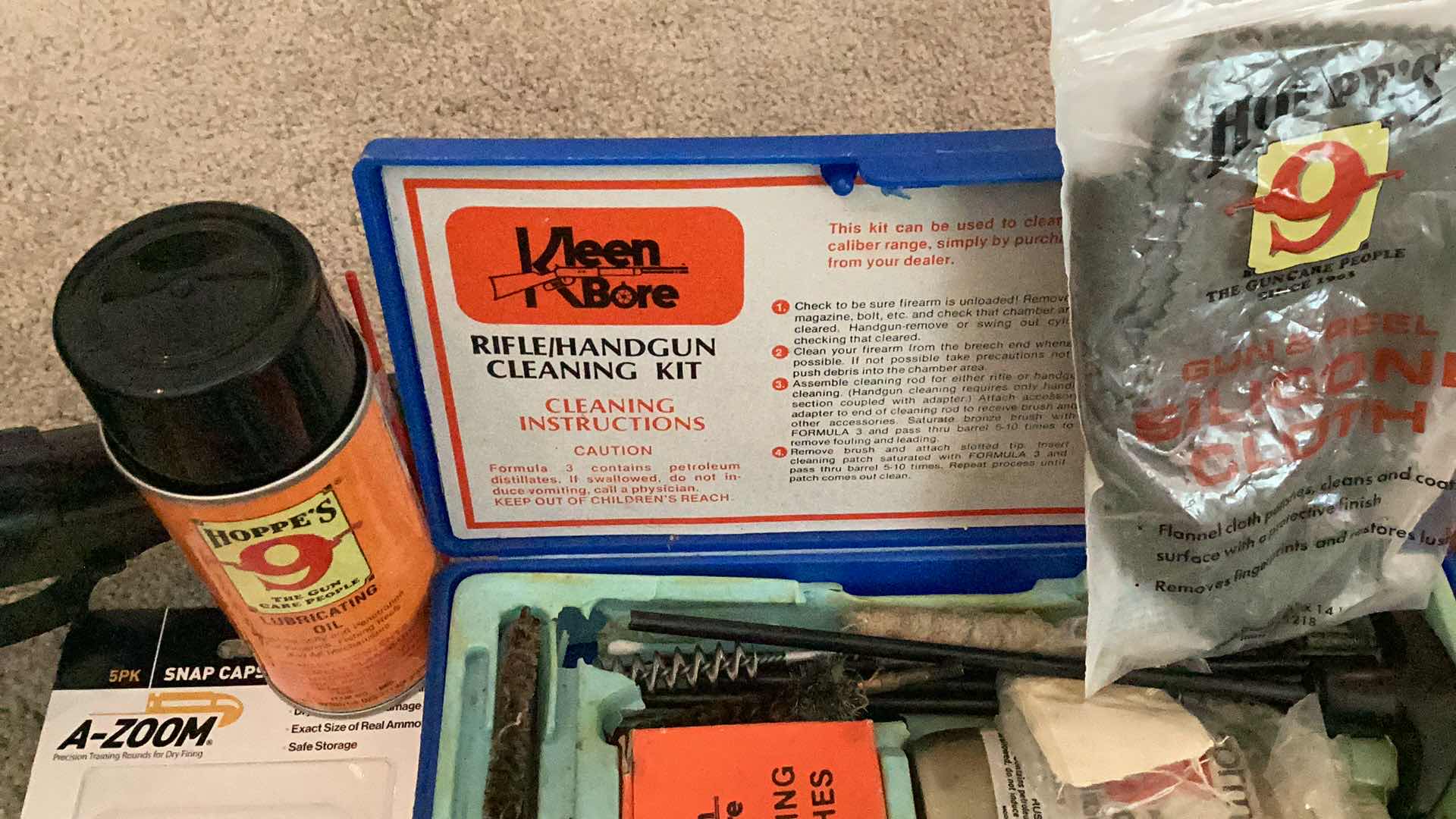 Photo 1 of MILITARY ISSUED  GUN CLEANING / MAINTENANCE TOOLS, AND RUBBER TRAINING GUN.