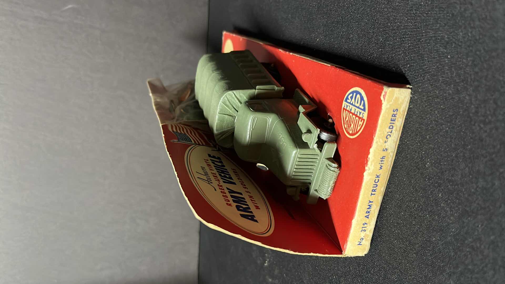Photo 1 of AUBURN TOYS RUBBER-LIKE VINYL ARMY VEHICLE W SOLDIERS (No. 319 ARMY TRUCK W 5 SOLDIERS)