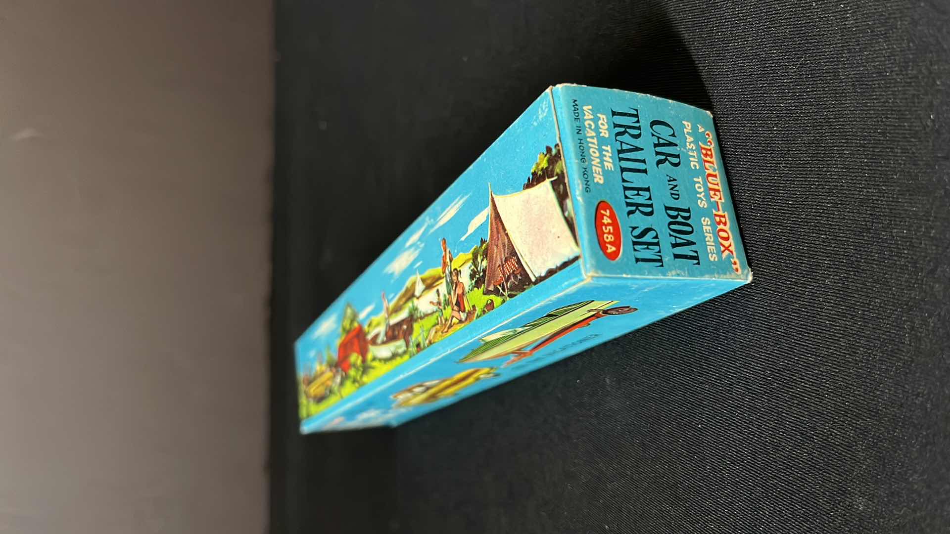 Photo 1 of A BLUE BOX PLASTIC TOY SERIES CAR AND BOAT TRAILER SET, FOR THE VACATIONER