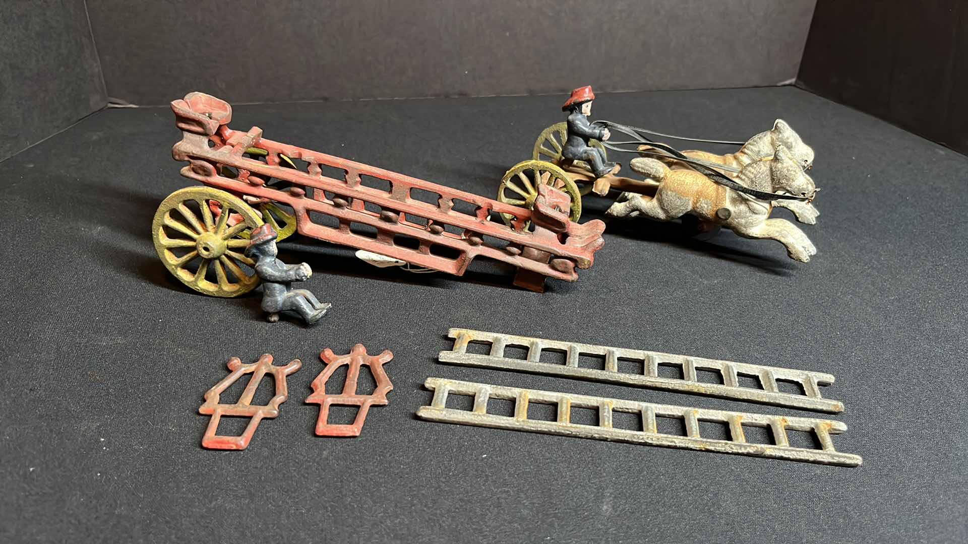 Photo 1 of ANTIQUE KENTON 14” CAST-IRON 2 HORSE FIRE WAGON HOOK & LADDER W 2 FIGURINES , 1915