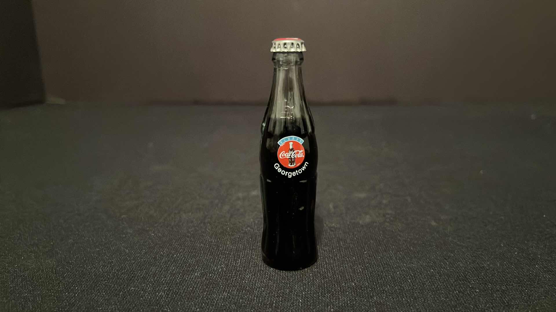 Photo 1 of COCA-COLA COLLECTIBLE MINI CLOCK ICE CHEST W COKE BOTTLE CASES 4”H, 2000 & COCA-COLA COLLECTIBLE GEORGETOWN MINI GLASS BOTTLE 3”H