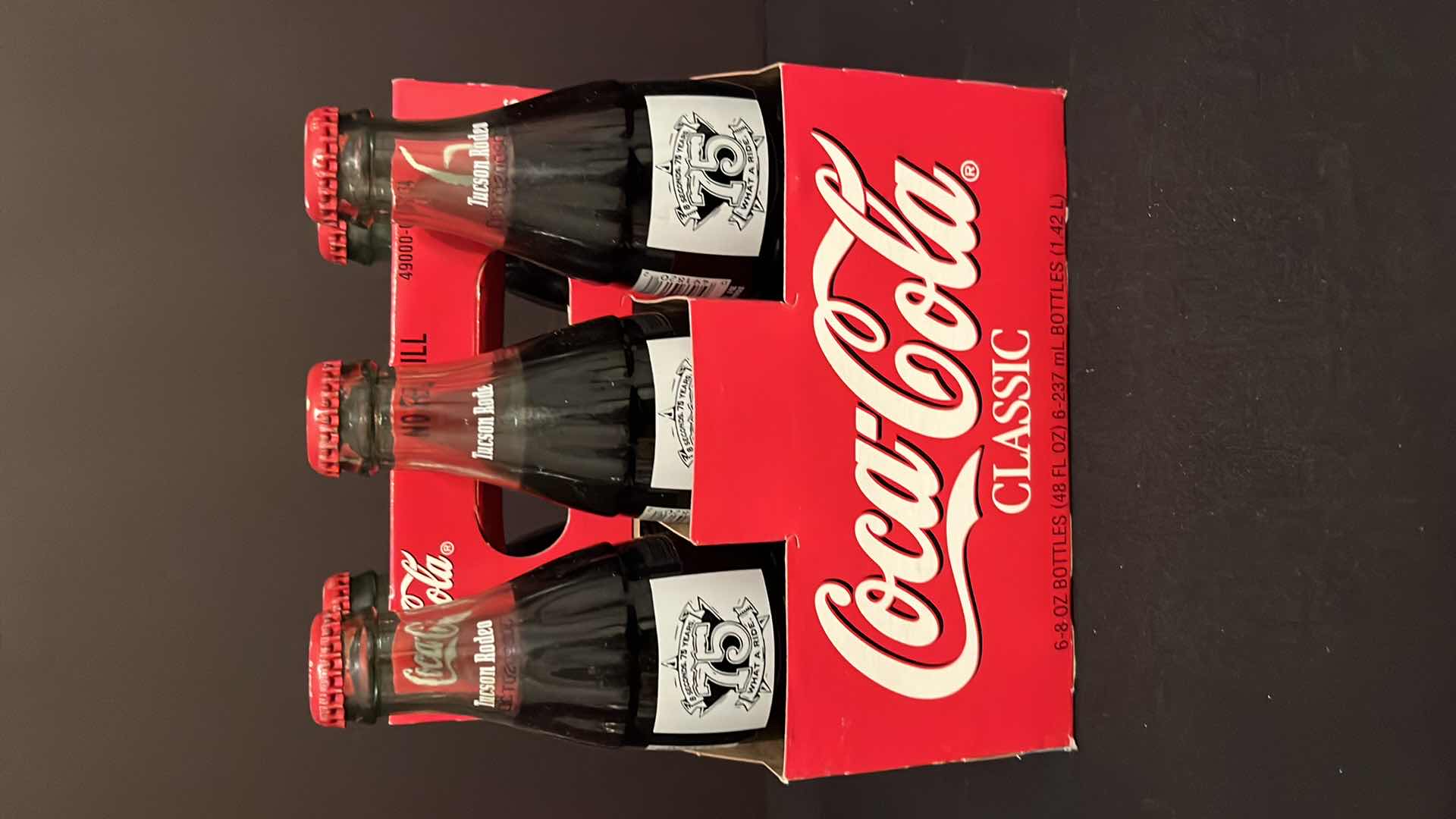 Photo 1 of COCA-COLA COMMEMORATIVE 6-PACK 8 OZ BOTTLES TUCSON RODEO 75TH ANNIVERSARY UNOPENED, 2000