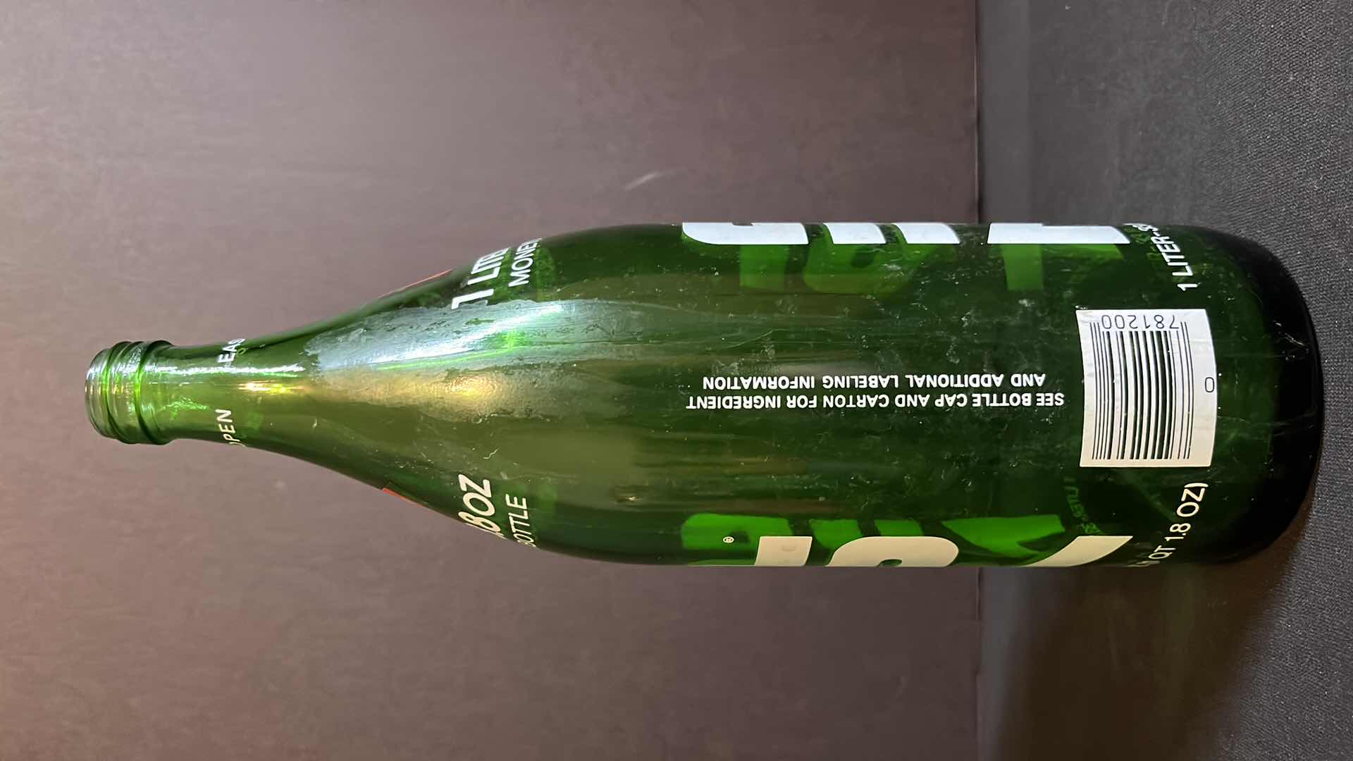 Photo 1 of VINTAGE 2-1970’S GREEN GLASS BOTTLES OF 7-UP RED DOT EDITION, 28 FL OZ & 1 LITER, EMPTY W NO CAPS