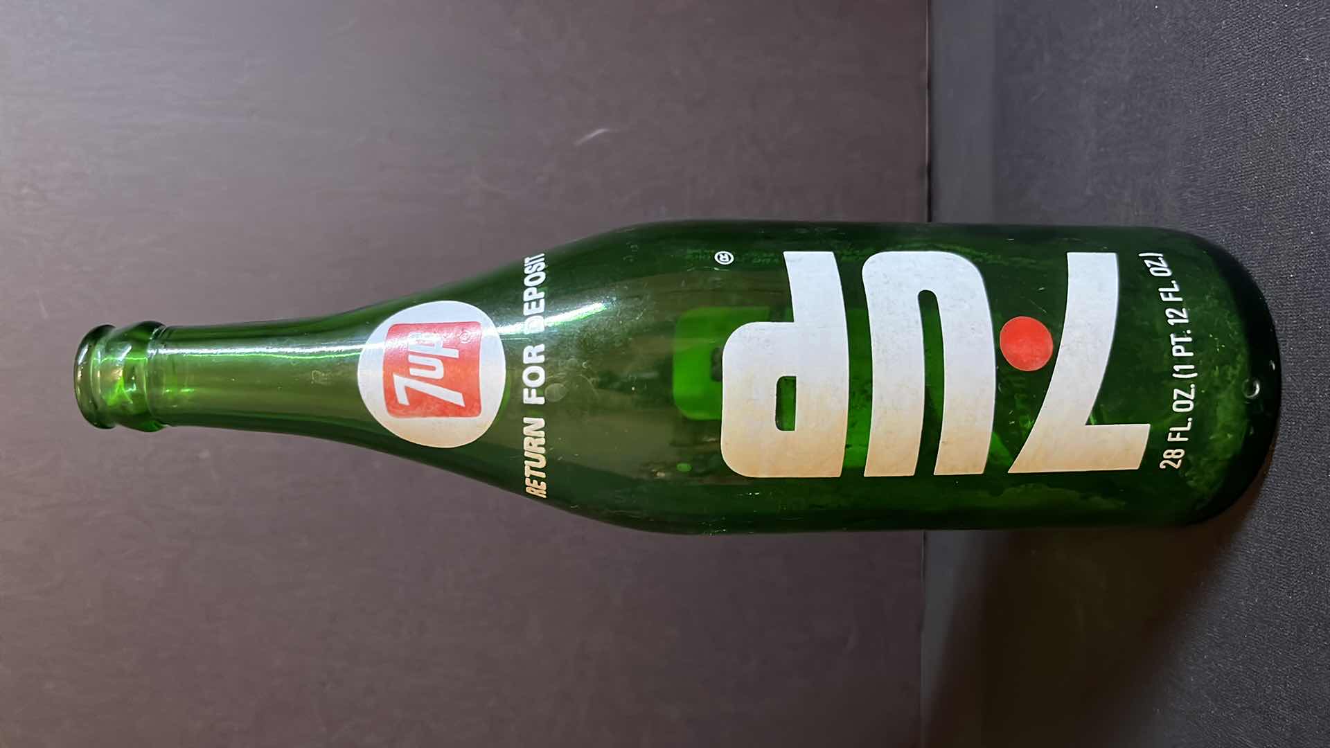 Photo 1 of VINTAGE 2-1970’S GREEN GLASS BOTTLES OF 7-UP RED DOT EDITION, 28 FL OZ & 1 LITER, EMPTY W NO CAPS