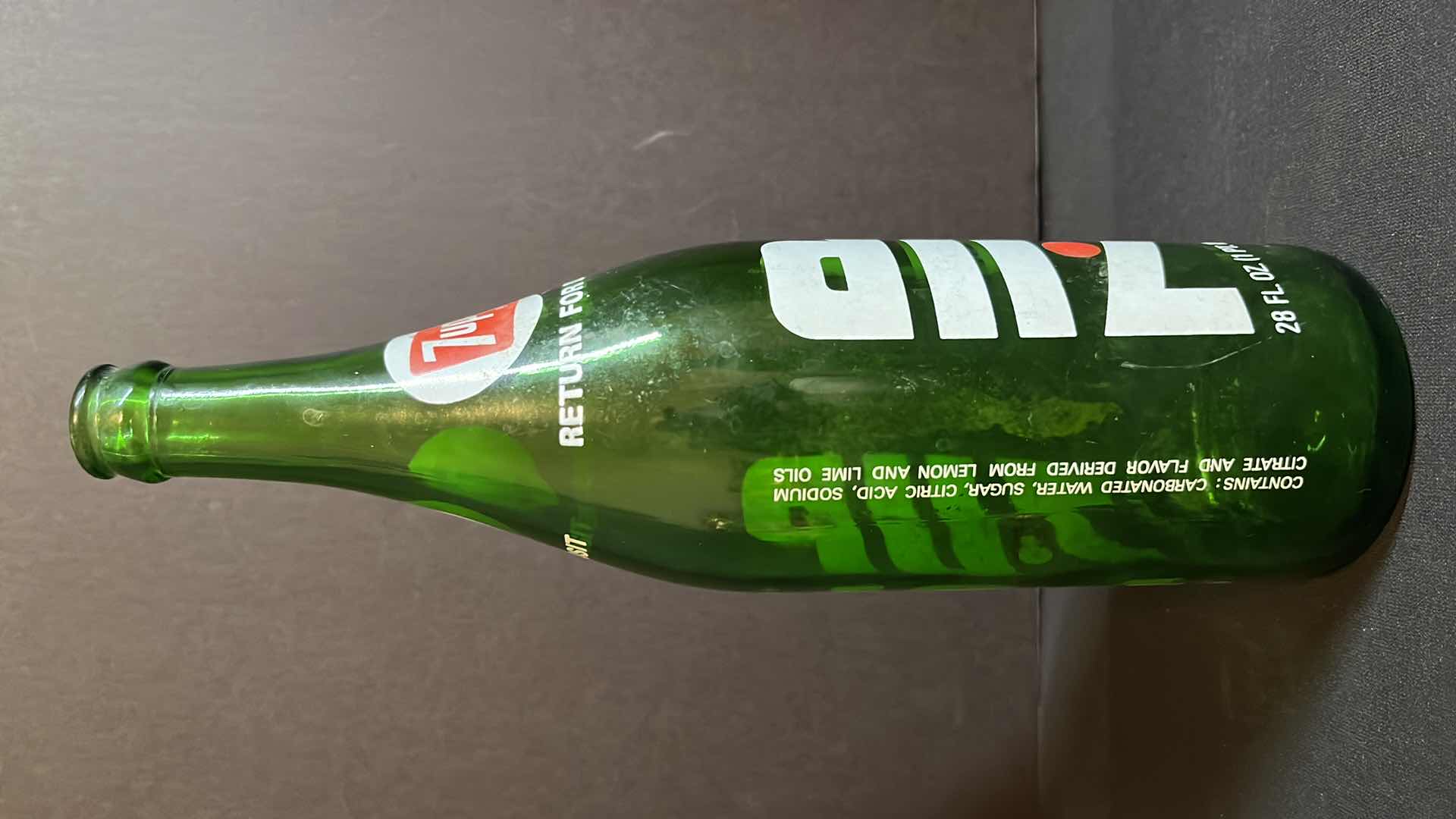 Photo 1 of VINTAGE 2-1970’S GREEN GLASS BOTTLES OF 7-UP RED DOT EDITION, 28 FL OZ & 1 LITER, EMPTY W NO CAPS