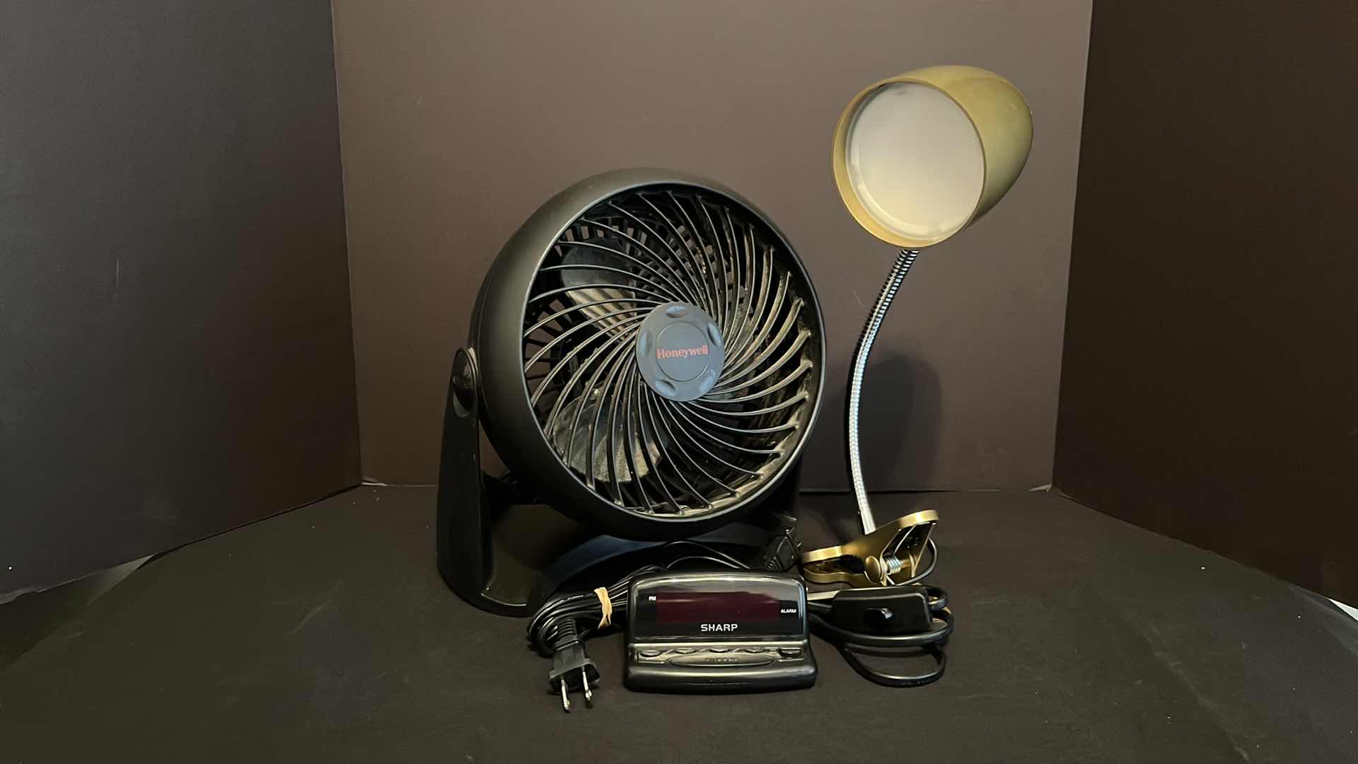 View 1 of HONEYWELL 8.5” CIRCULAR FAN (HT-900), INTERTEK BRONZE CLIP-ON DESK LAMP & SHARP DIGITAL ALARM CLOCK