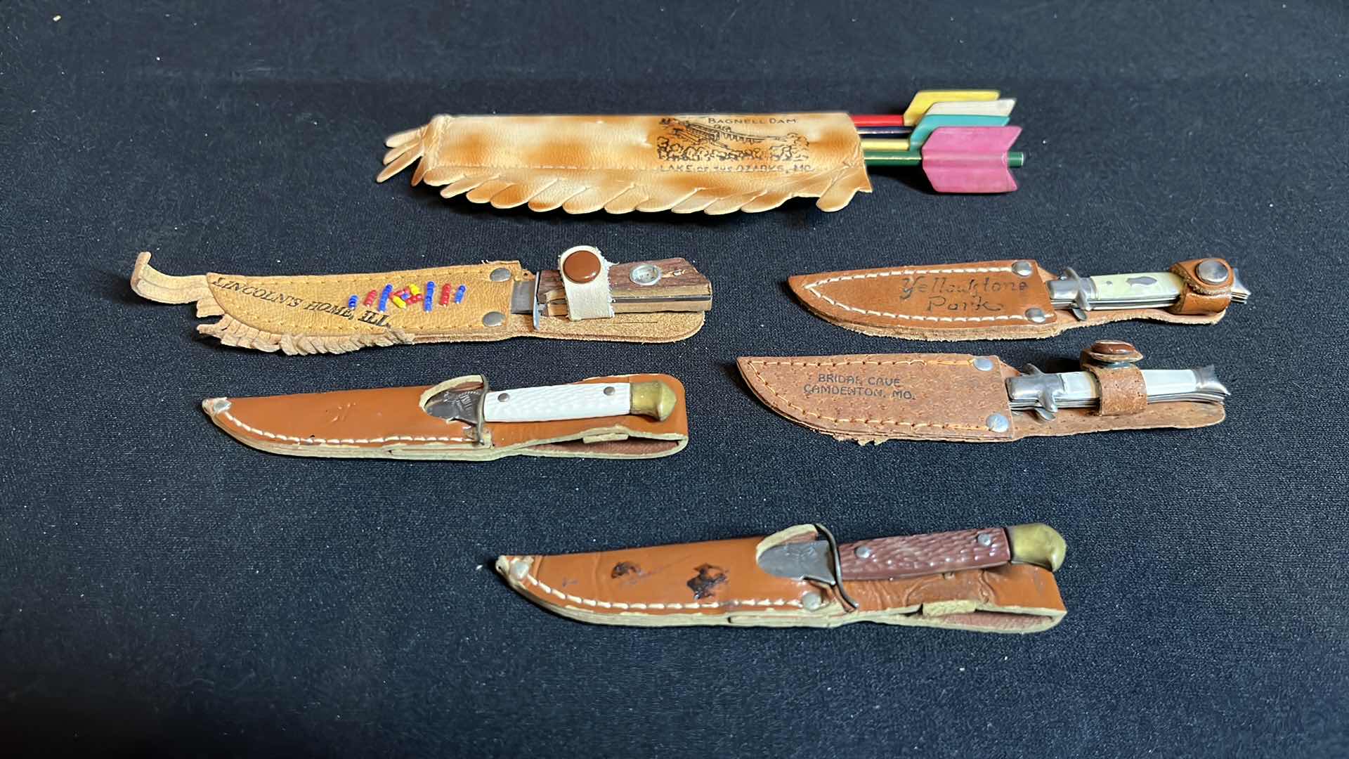 Photo 1 of COLLECTIBLE 4-ARROW PENCILS WITH BAG & 5-MINIATURE KNIVES W LEATHER SHEATHS 4”