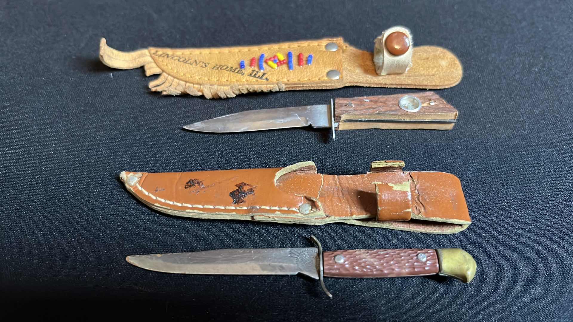 Photo 1 of COLLECTIBLE 4-ARROW PENCILS WITH BAG & 5-MINIATURE KNIVES W LEATHER SHEATHS 4”