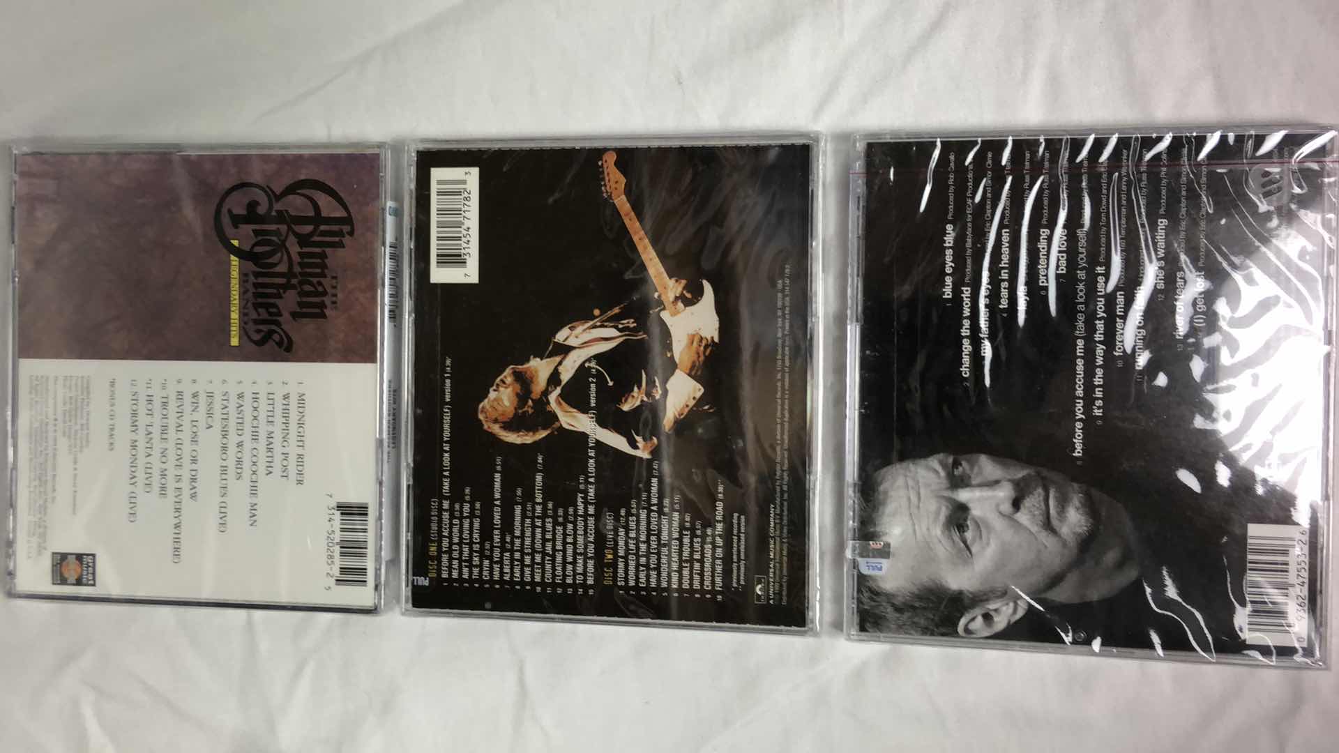 Photo 1 of ASSORTED MUSIC CDS ALLMAN BROTHERS, ERIC CLAPTON, REO SPEEDWAGON (5)