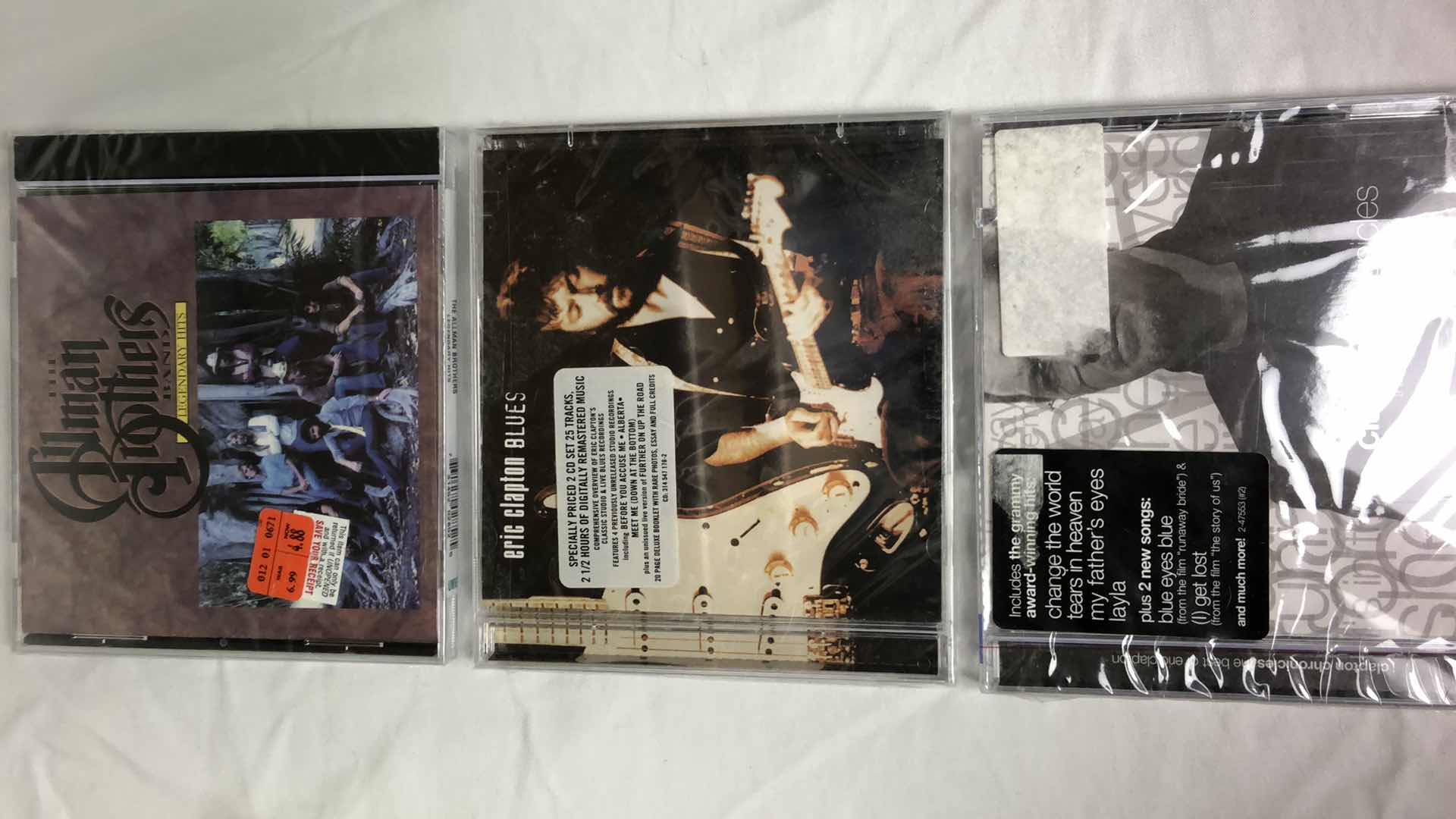 Photo 1 of ASSORTED MUSIC CDS ALLMAN BROTHERS, ERIC CLAPTON, REO SPEEDWAGON (5)