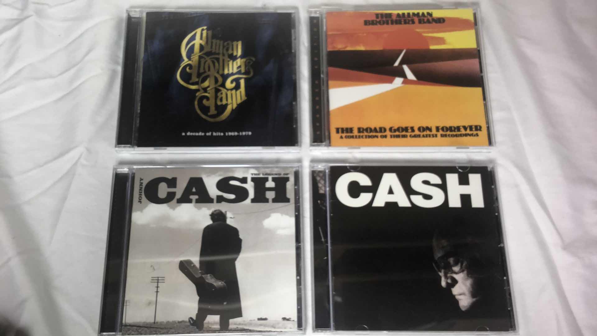 Photo 1 of ASSORTMENT OF JOHNNY CASH & ALLMAN BROTHERS ALBUM CDS (4)