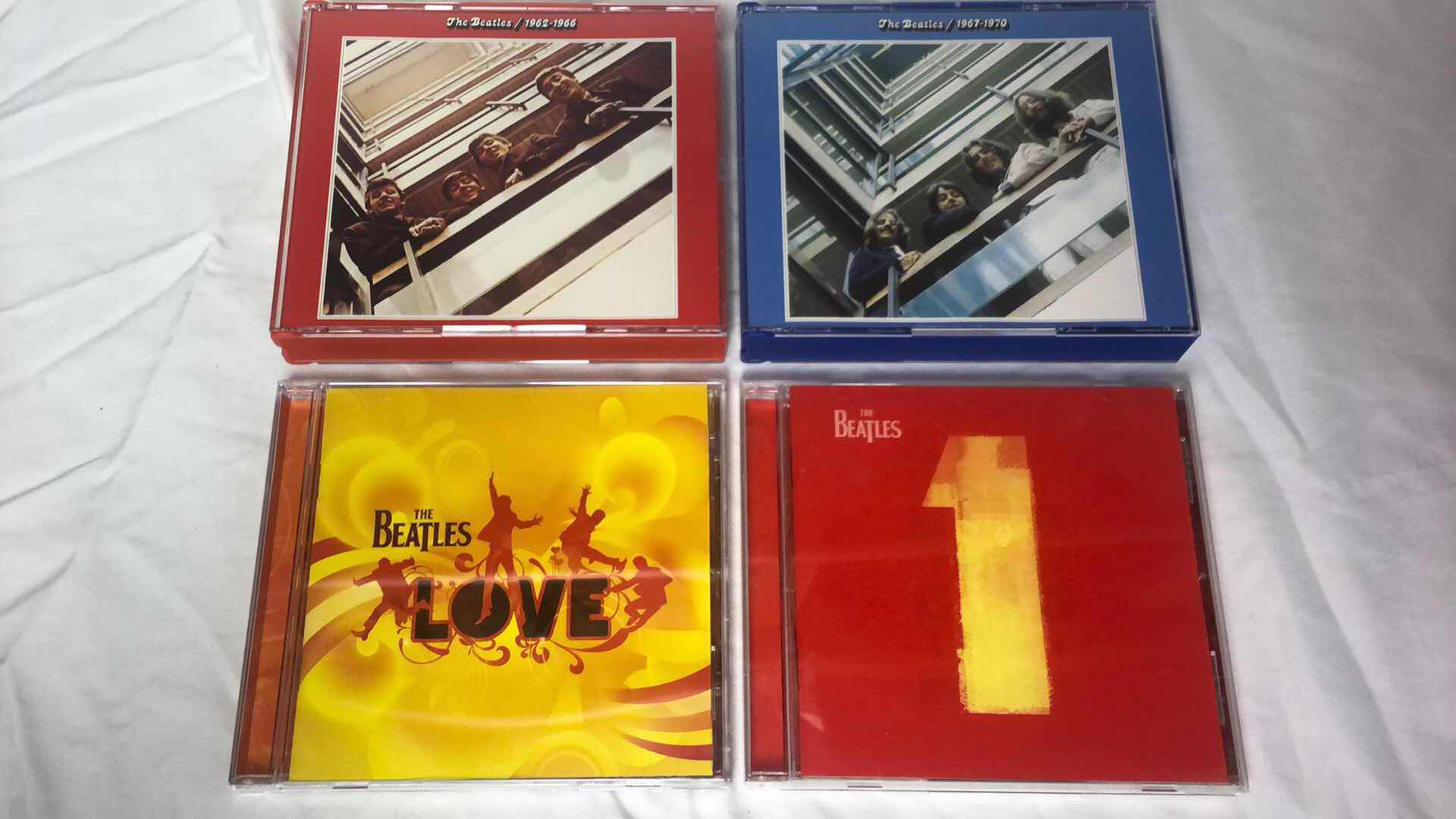 Photo 1 of ASSORTMENT OF THE BEATLES ALBUMS CDS (6)