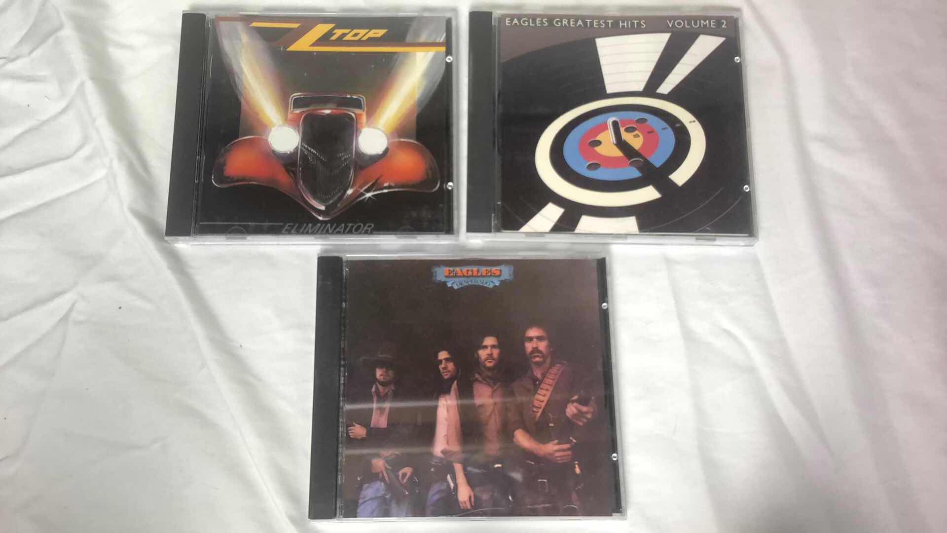 Photo 1 of ASSORTED ROCK ALBUM CDS EAGLES, ZZ TOP, CANDLEBOX (6)
