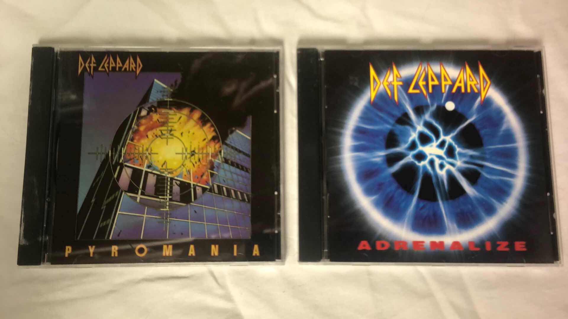 Photo 1 of ASSORTED DEF LEPPARD AND CHEAP TRICK ALBUM CDS (4)