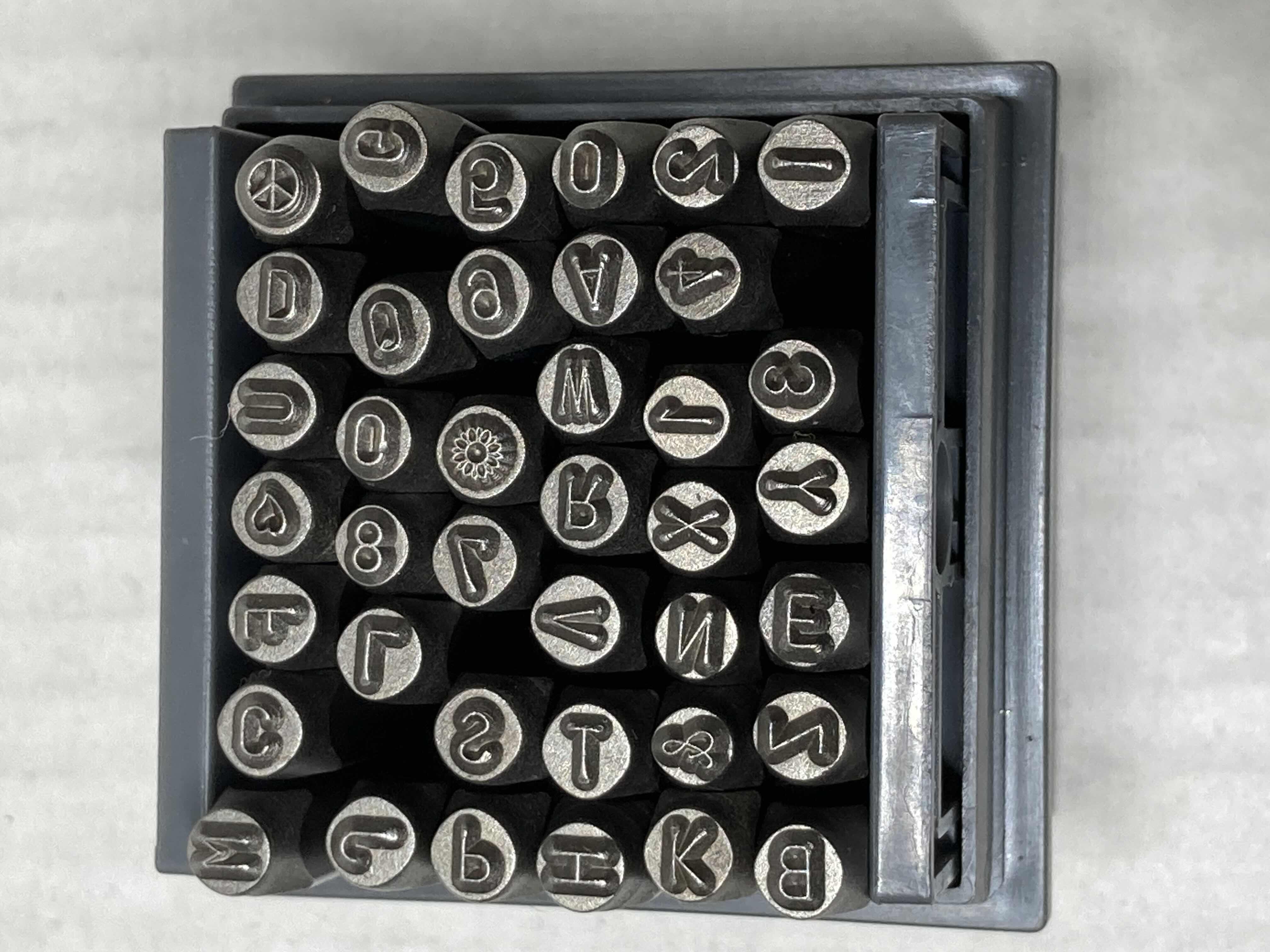 Photo 1 of NEW TONOSHO 39 BIT STAMP KIT W CASE