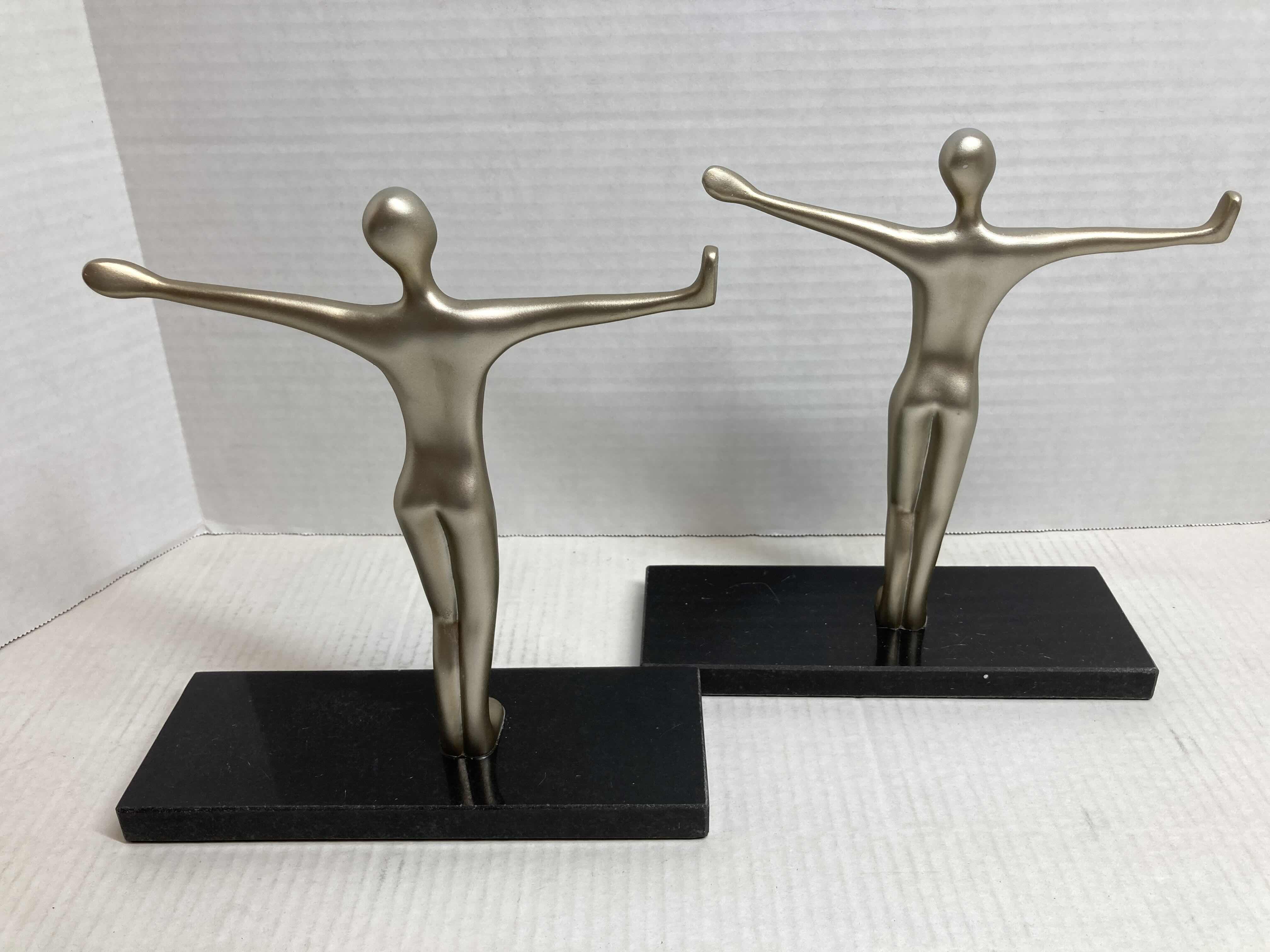 Photo 1 of NEW METALLIC FINISH CROSS POSE RESIN FIGURE W POLISHED BLACK STONE BASE BOOK ENDS 8” X 9”