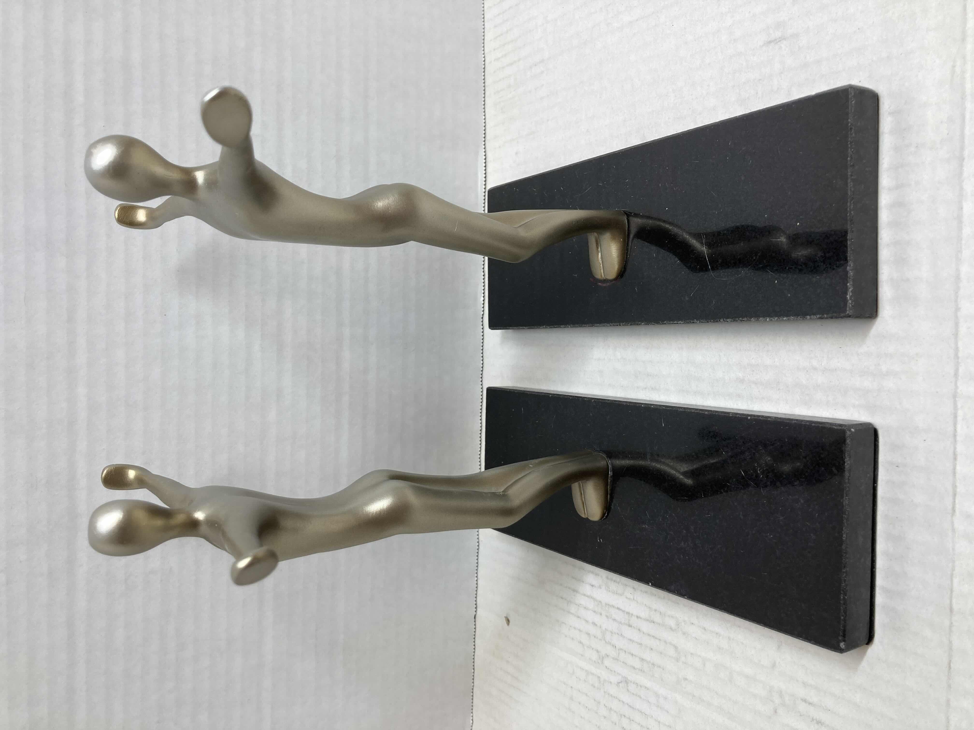 Photo 1 of NEW METALLIC FINISH CROSS POSE RESIN FIGURE W POLISHED BLACK STONE BASE BOOK ENDS 8” X 9”