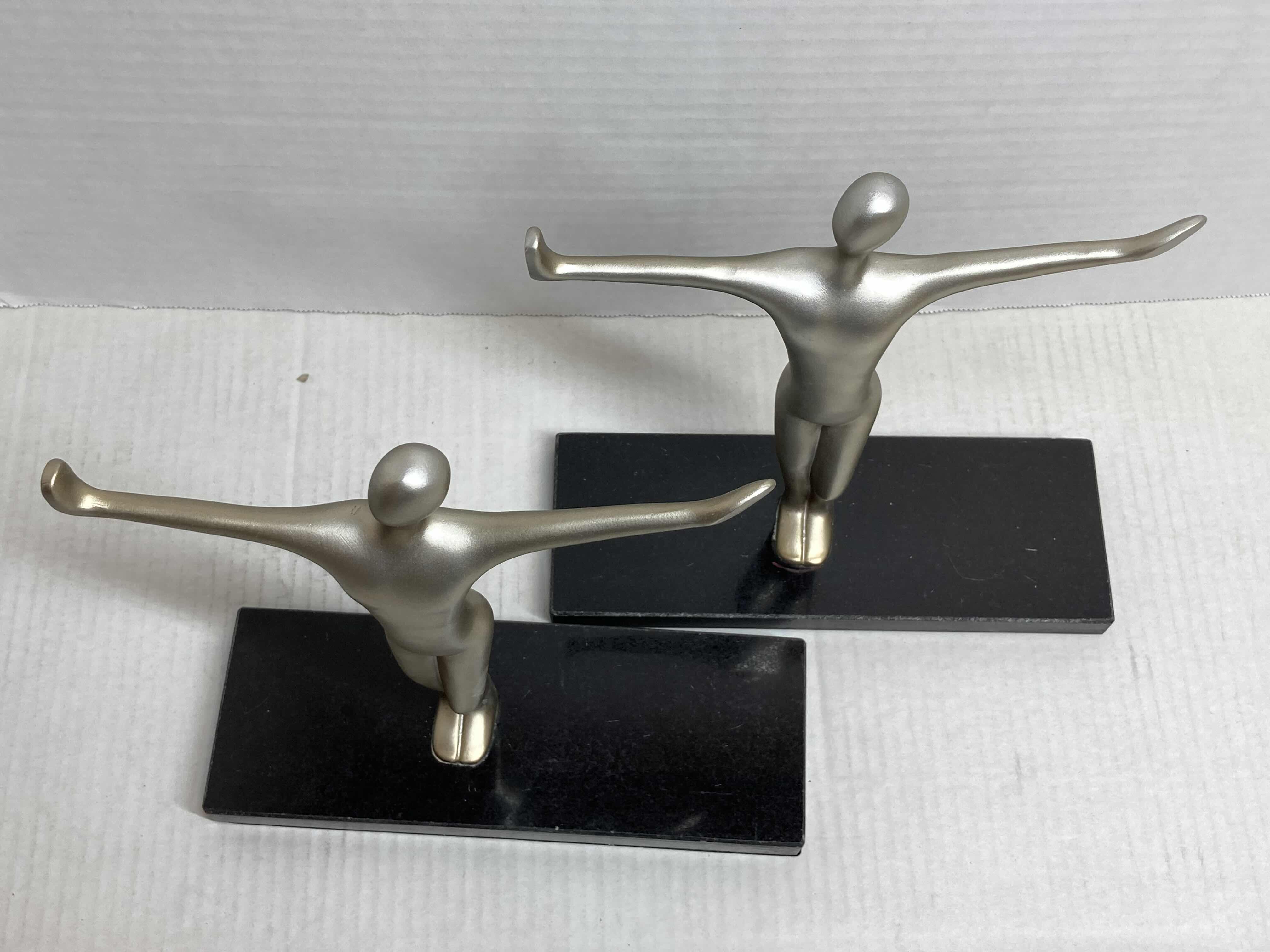 Photo 1 of NEW METALLIC FINISH CROSS POSE RESIN FIGURE W POLISHED BLACK STONE BASE BOOK ENDS 8” X 9”