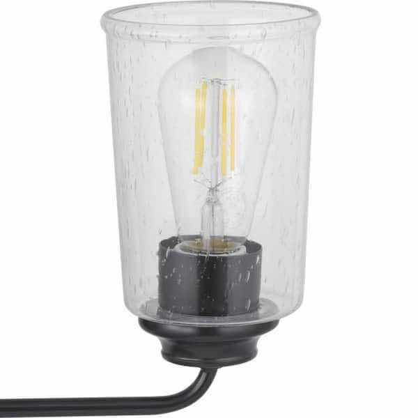 Photo 1 of HAMPTON BAY EVANGELINE FARMHOUSE MATTE BLACK CLEAR GLASS SHADE 3 LIGHT VANITY FIXTURE LIGHT 785247251599