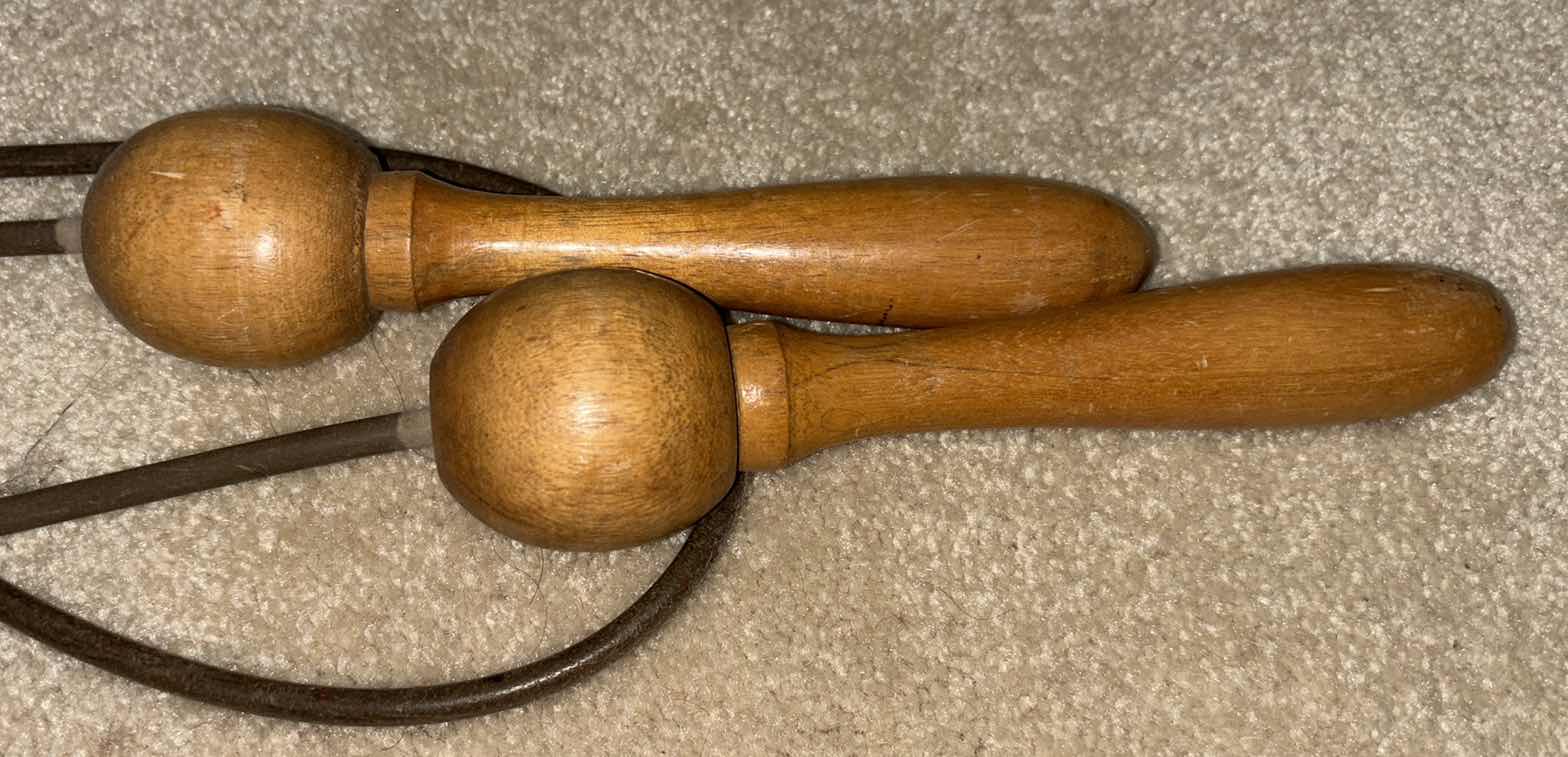 Photo 1 of VINTAGE EXERCISE EQUIPMENT, LEATHER WOODEN HANDLE SKIP JUMP ROPE & 5-SPRING CHEST/ARM PULL W WOOD HANDLES