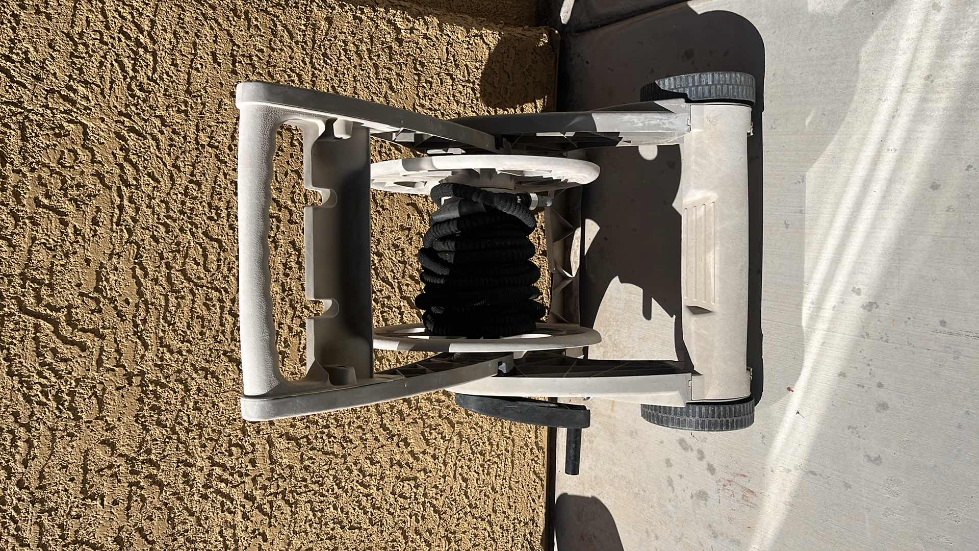 Photo 1 of HOSE MOBLE OUTDOOR WATER HOSE DISPENSER W EXTENDING POCKET HOSE