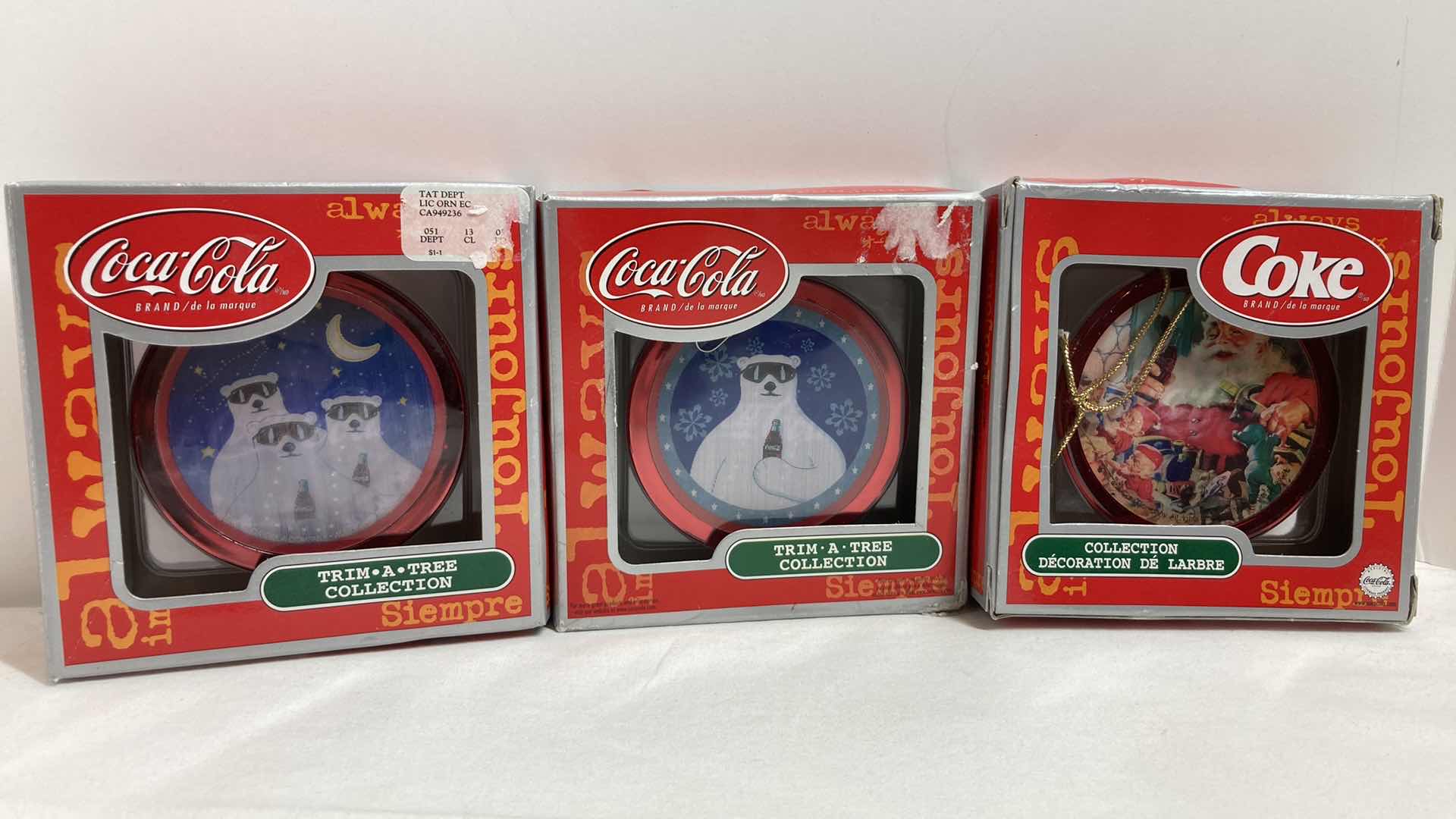 Photo 1 of COCA-COLA TRIM A TREE COLLECTION HOLOGRAPHIC ORNAMENTS (3)